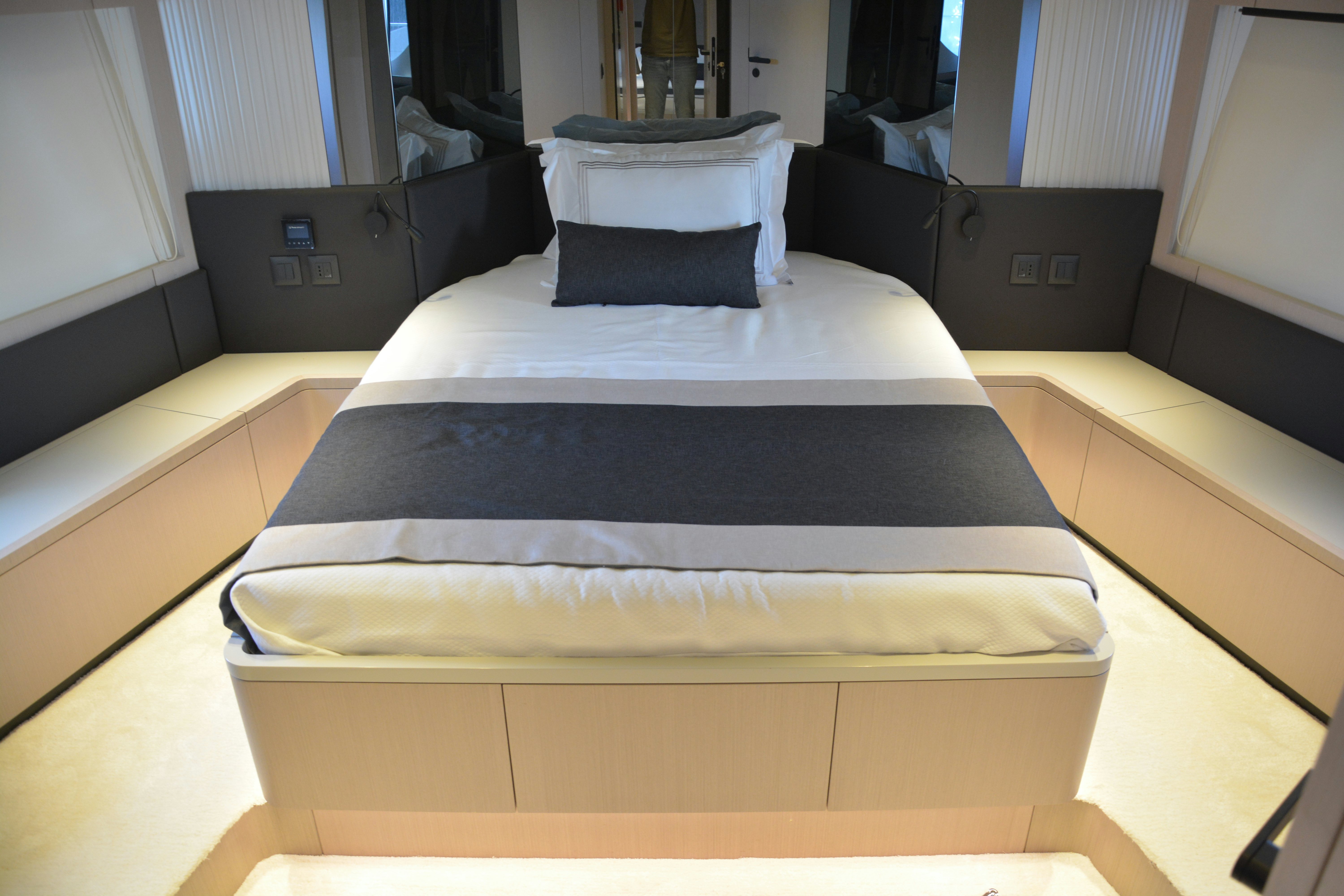 a bed in a room aboard ZIMA Yacht for Sale