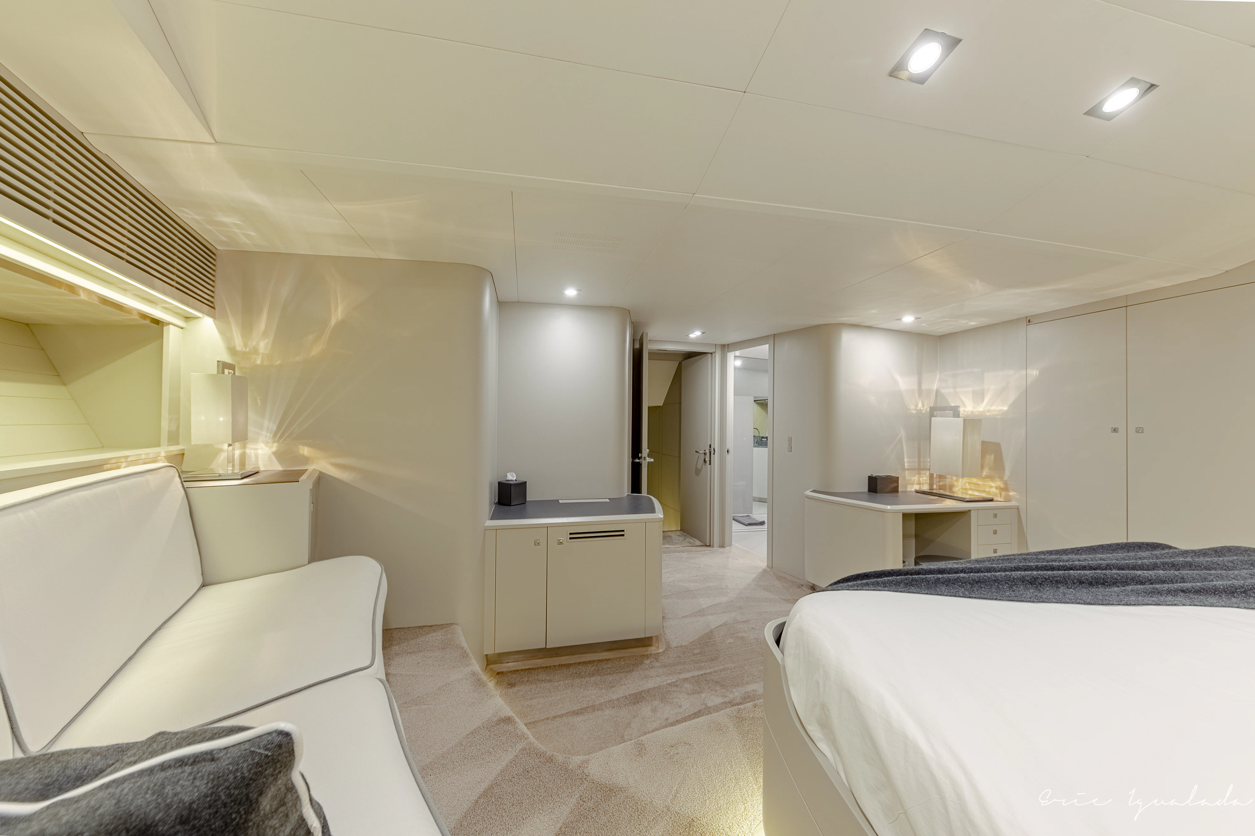 a room with a bed and a desk aboard MY STAR Yacht for Sale