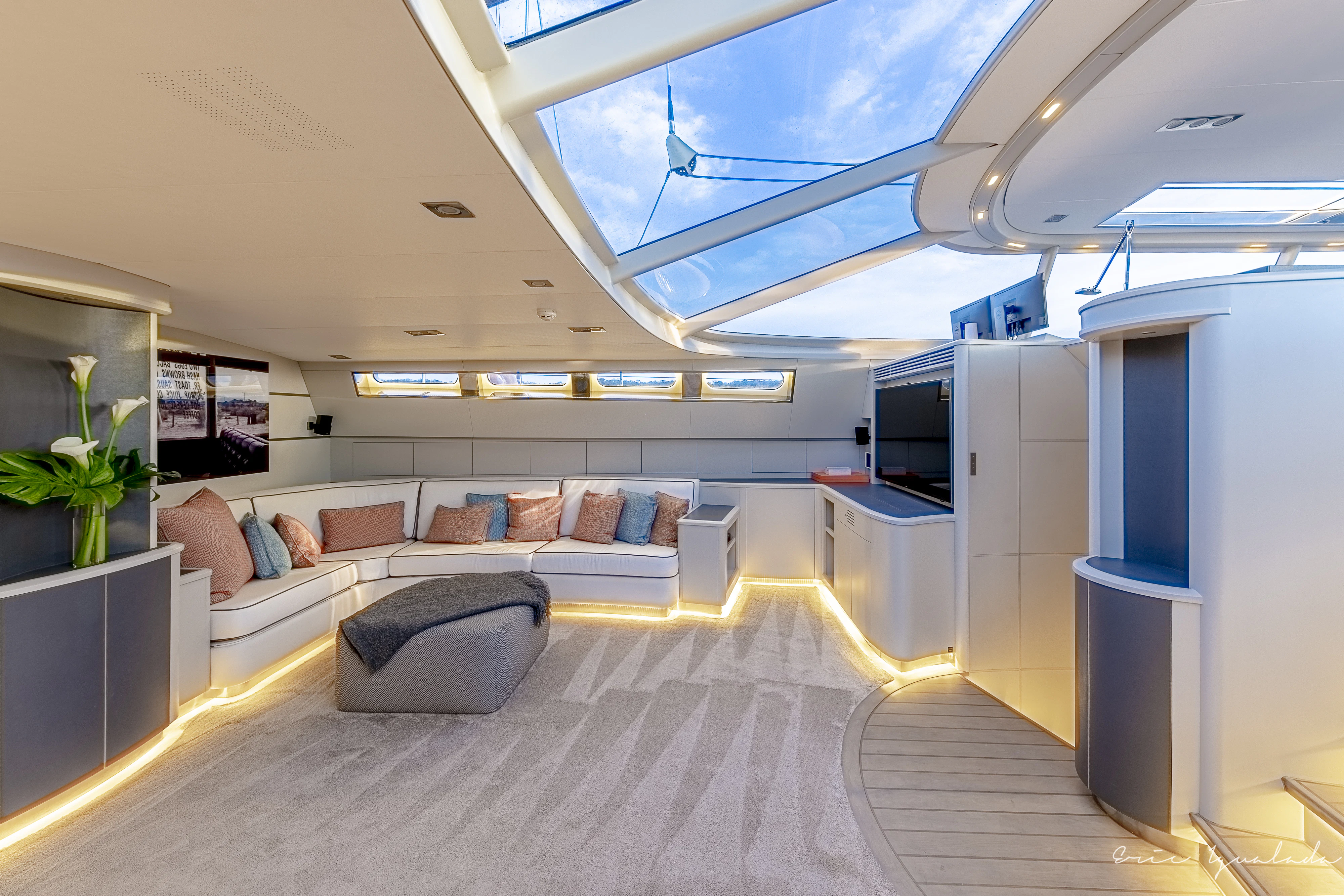 a large room with a couch and a tv aboard MY STAR Yacht for Sale