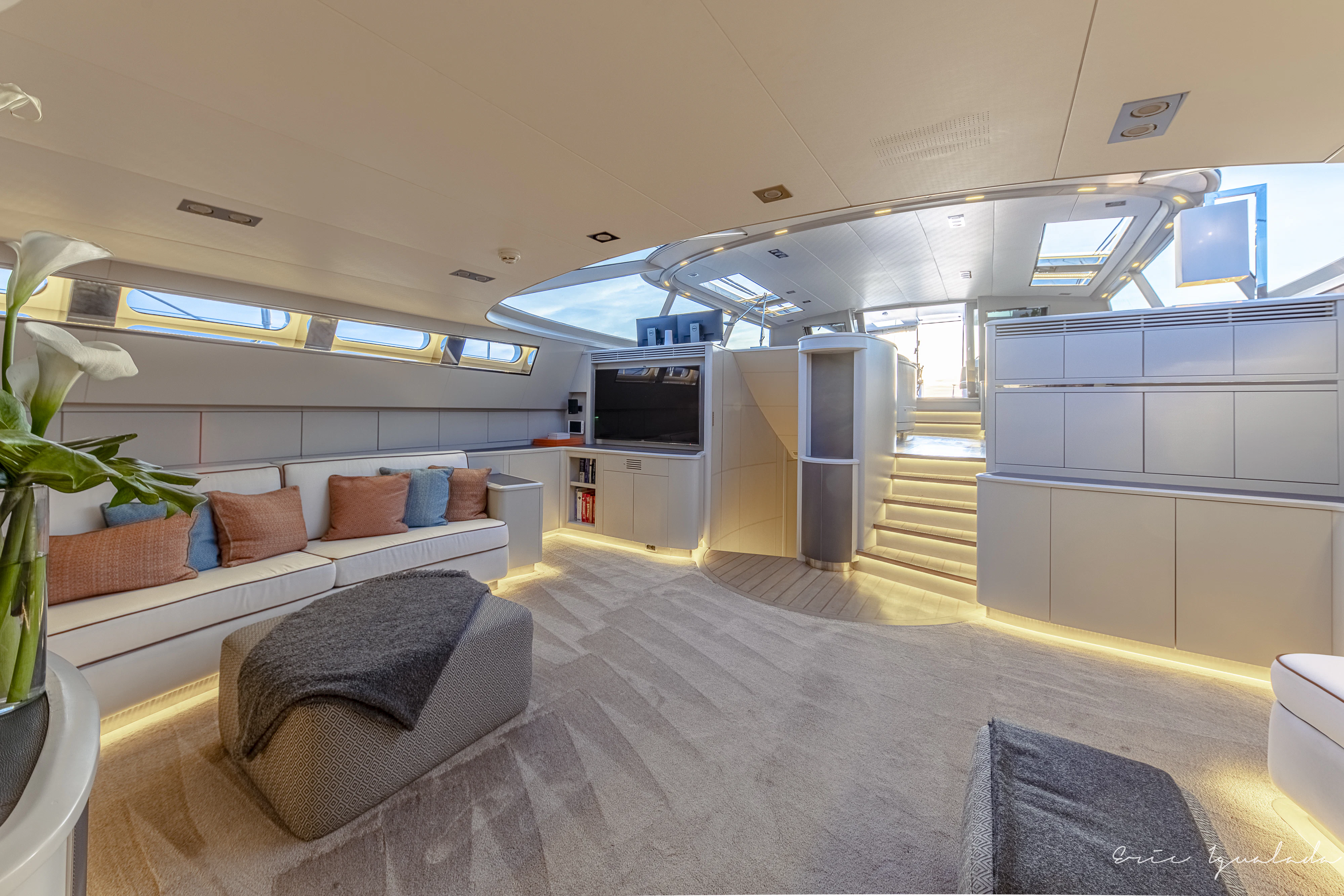 a room with a couch and a television aboard MY STAR Yacht for Sale