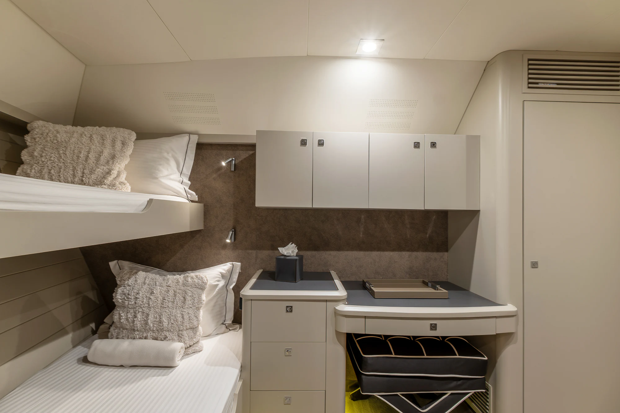 a room with a bed and desk aboard MY STAR Yacht for Sale