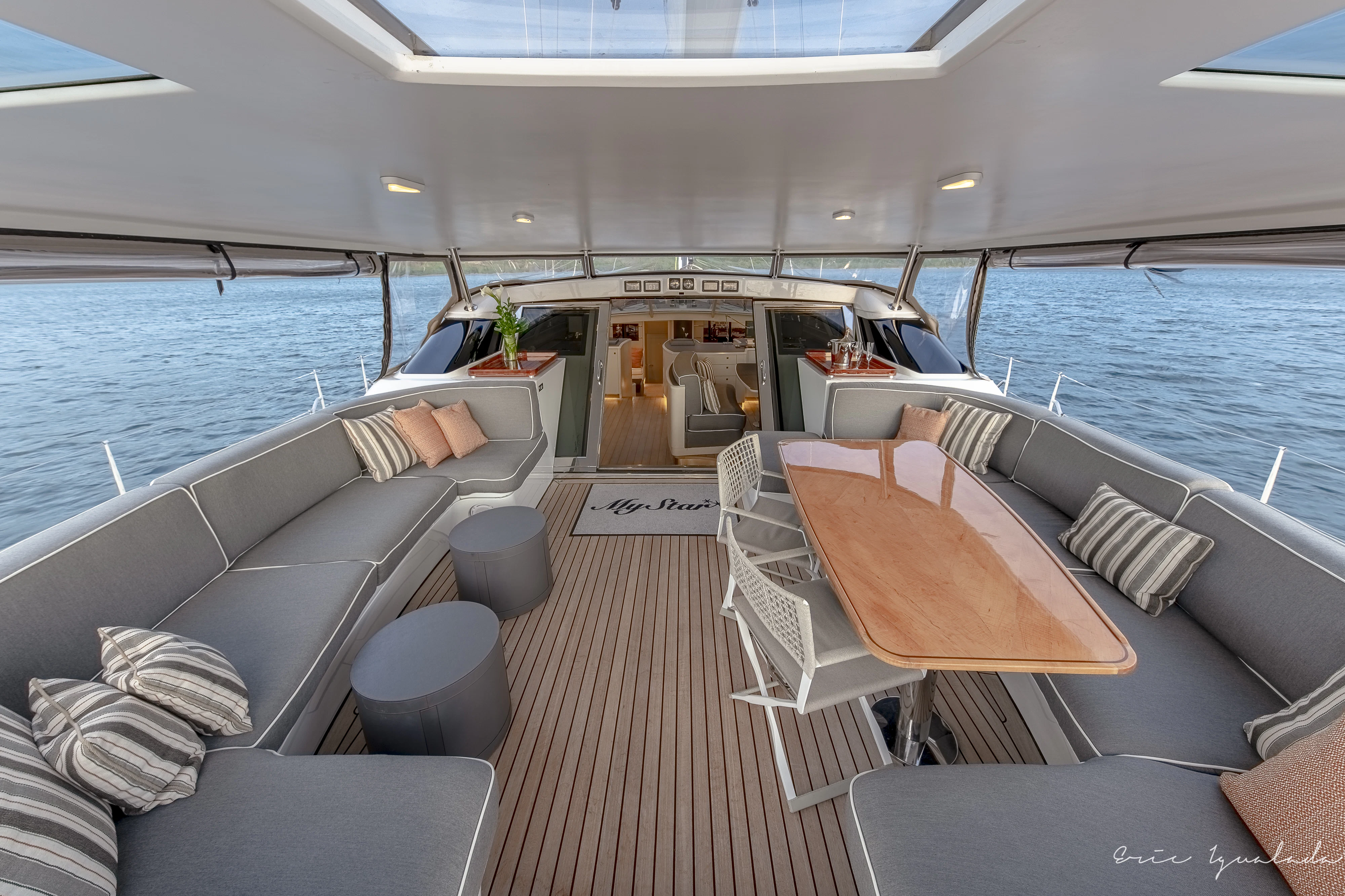 a boat with a table and chairs aboard MY STAR Yacht for Sale