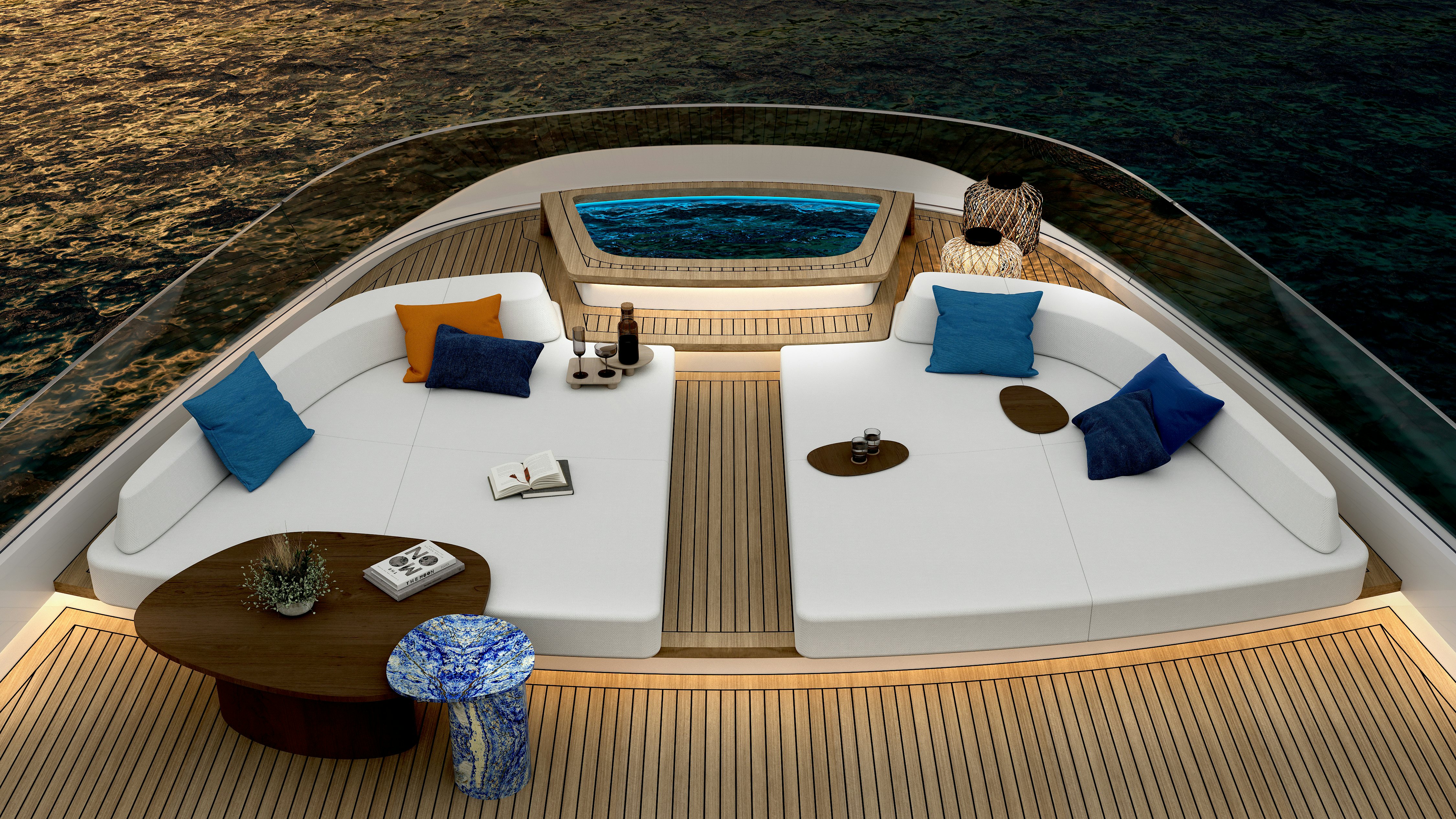 a large white lounge chair on a beach with blue pillows and a pool aboard HIU Yacht for Sale