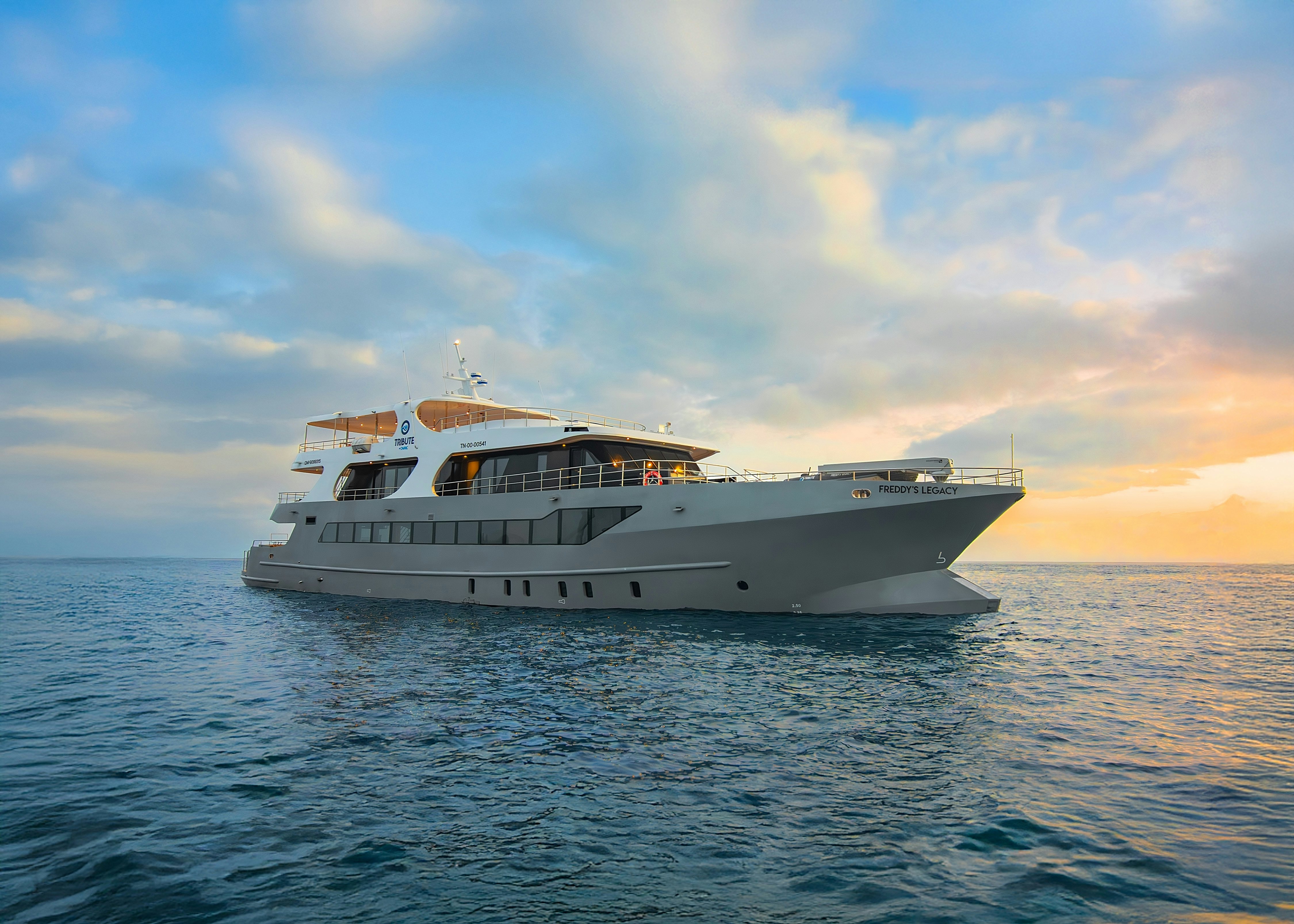 a white yacht in the water aboard FREDDY'S LEGACY Yacht for Charter