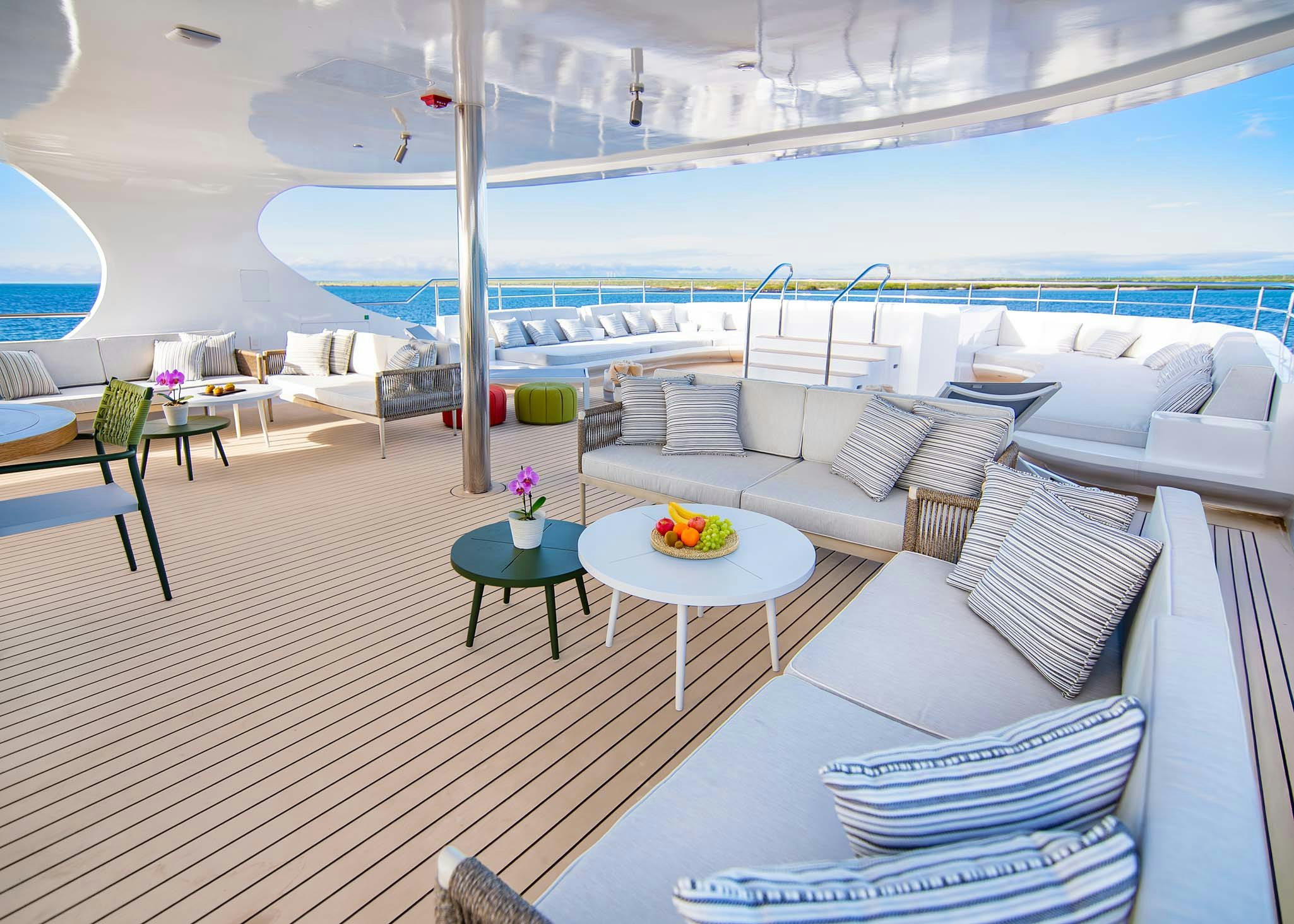 a room with a table chairs and a pool aboard TRIBUTE - FREDDY'S LEGACY Yacht for Charter