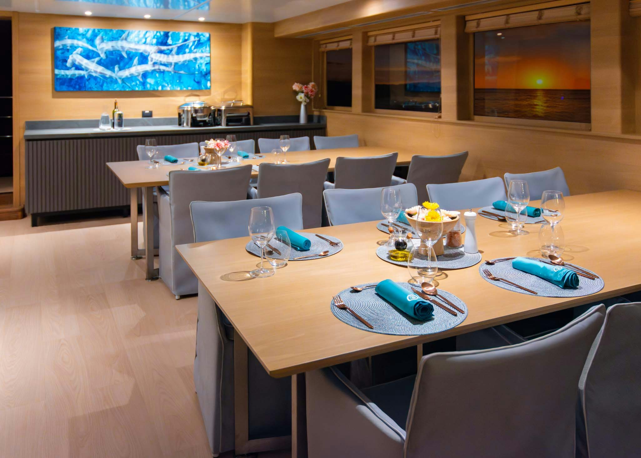 a table with plates and glasses on it aboard TRIBUTE - FREDDY'S LEGACY Yacht for Charter