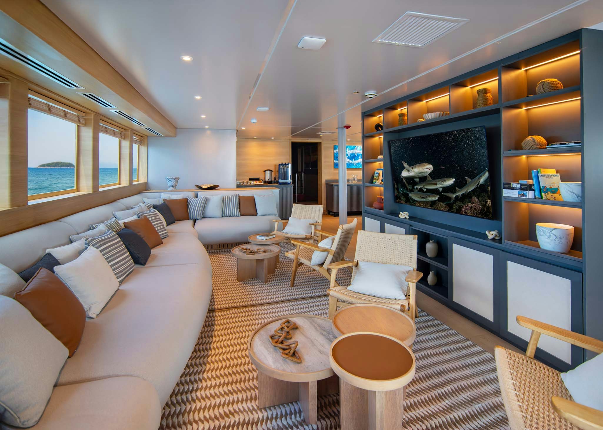 a living room with a fireplace aboard TRIBUTE - FREDDY'S LEGACY Yacht for Charter