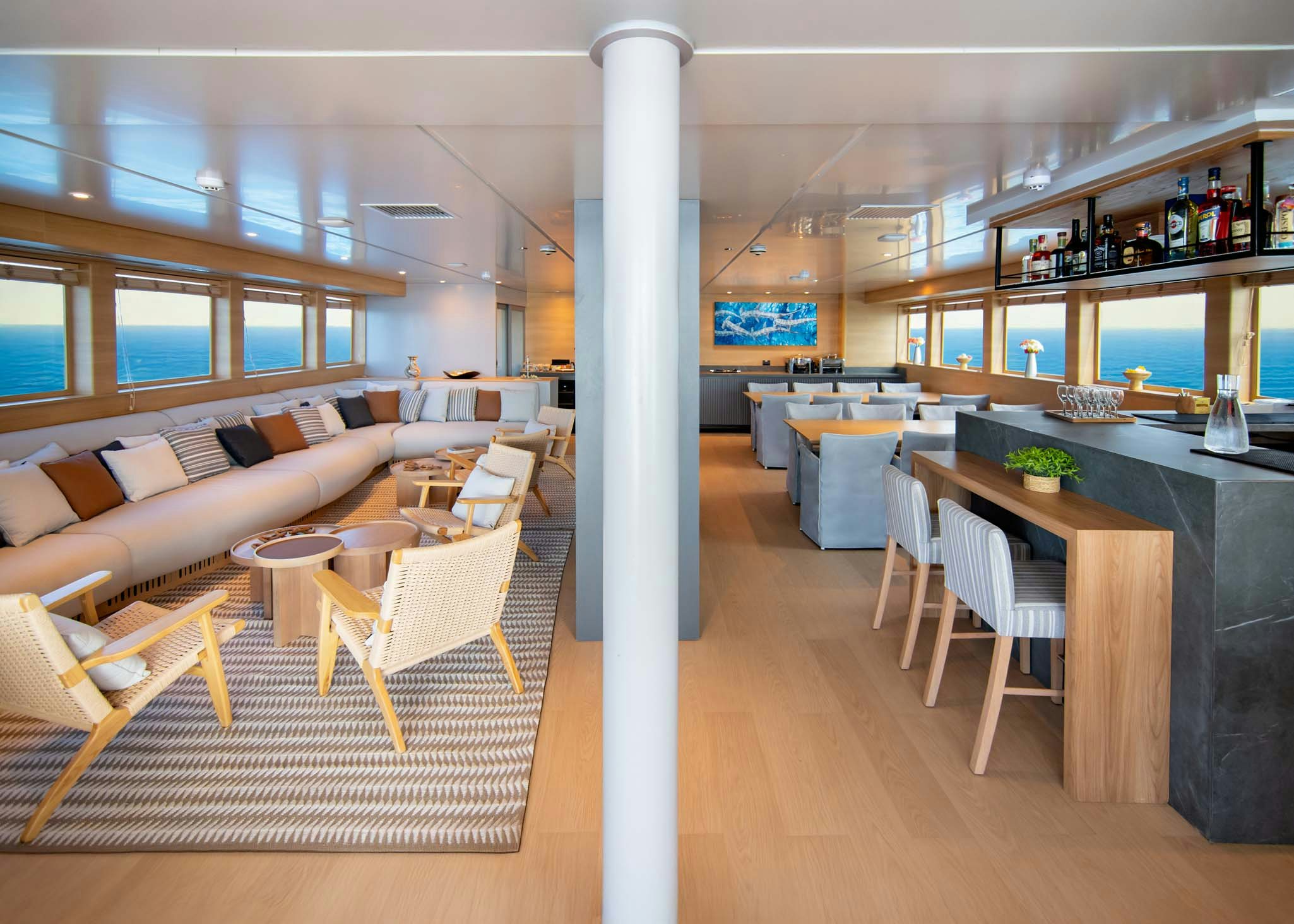 a large room with a table and chairs aboard TRIBUTE - FREDDY'S LEGACY Yacht for Charter
