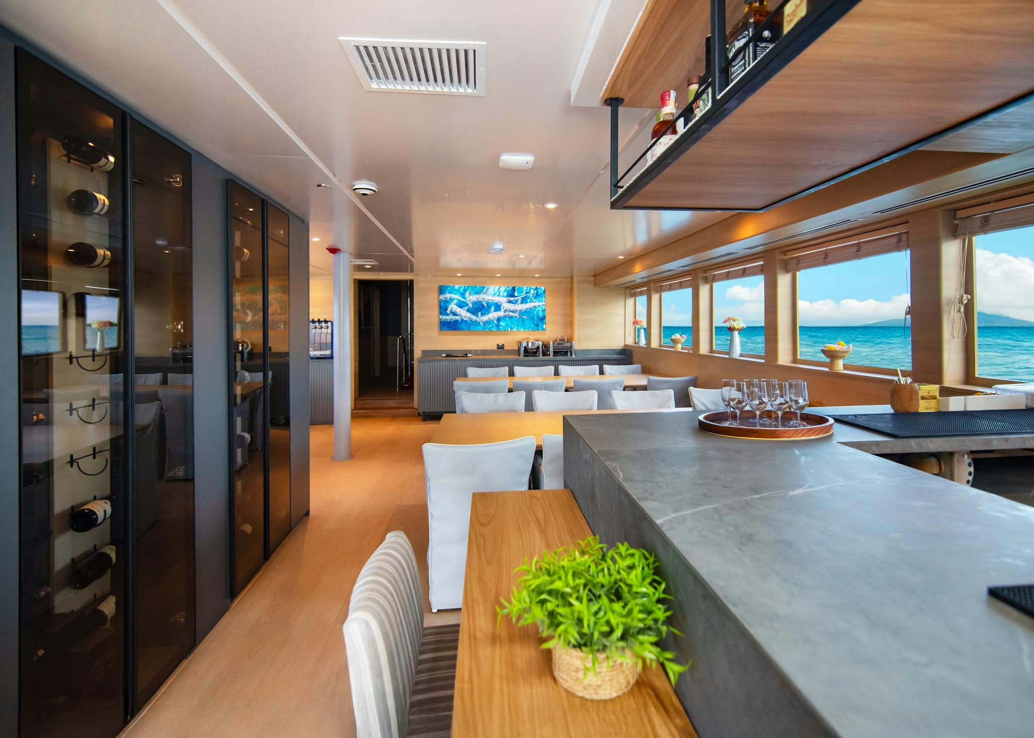 a room with a table and chairs aboard TRIBUTE - FREDDY'S LEGACY Yacht for Charter