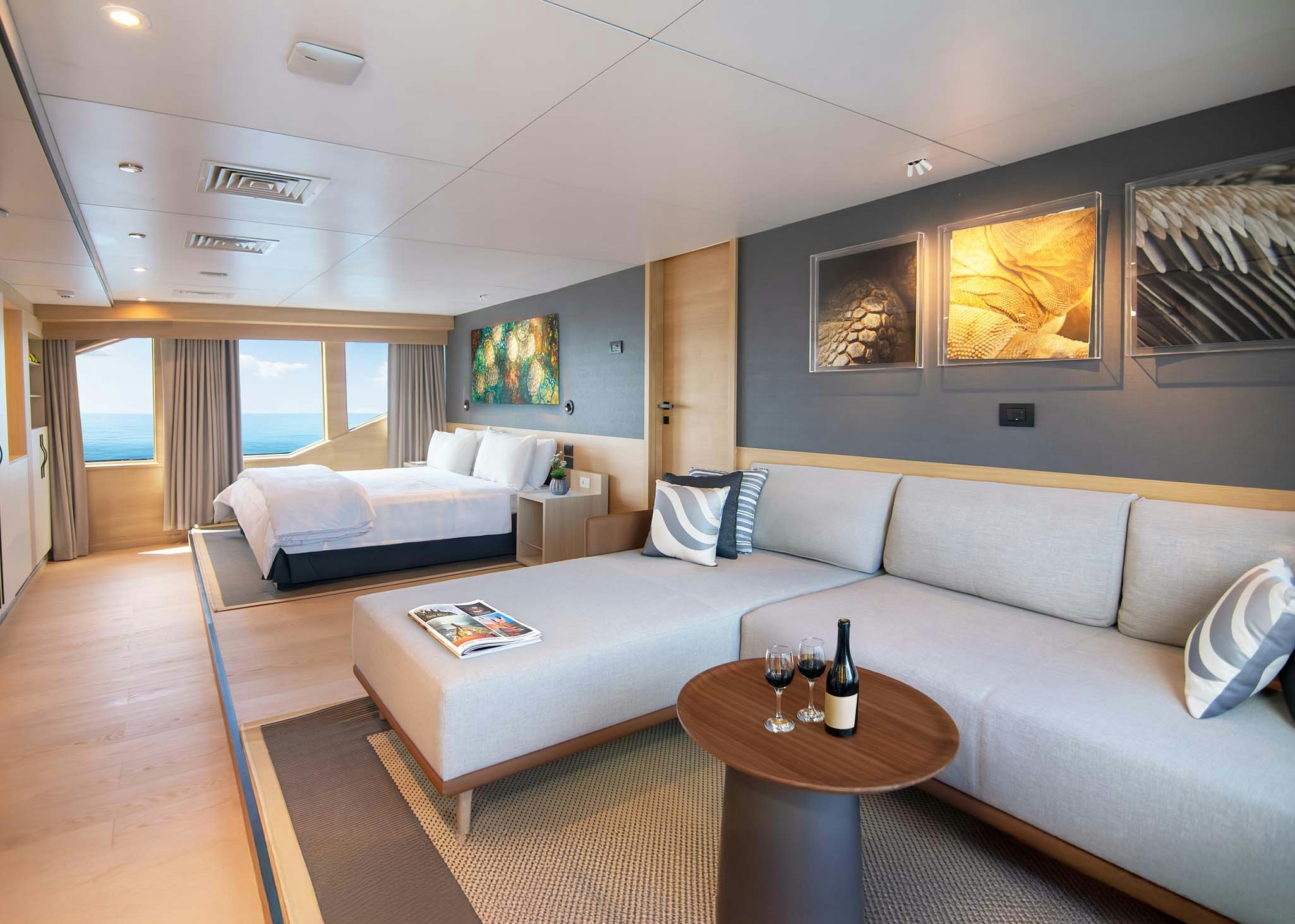 a living room with a couch and a table aboard TRIBUTE - FREDDY'S LEGACY Yacht for Charter