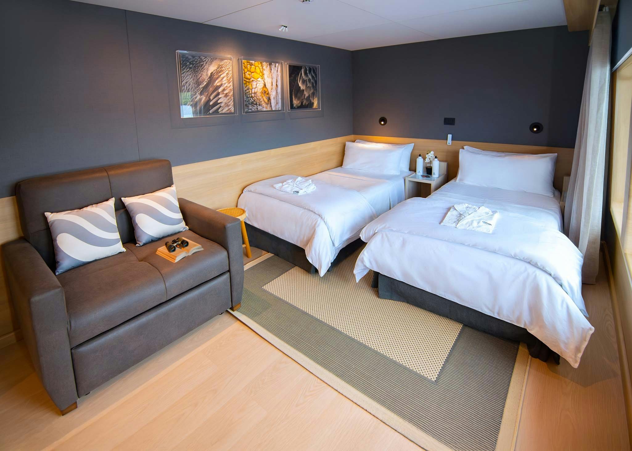 a room with a couch and a bed aboard TRIBUTE - FREDDY'S LEGACY Yacht for Charter