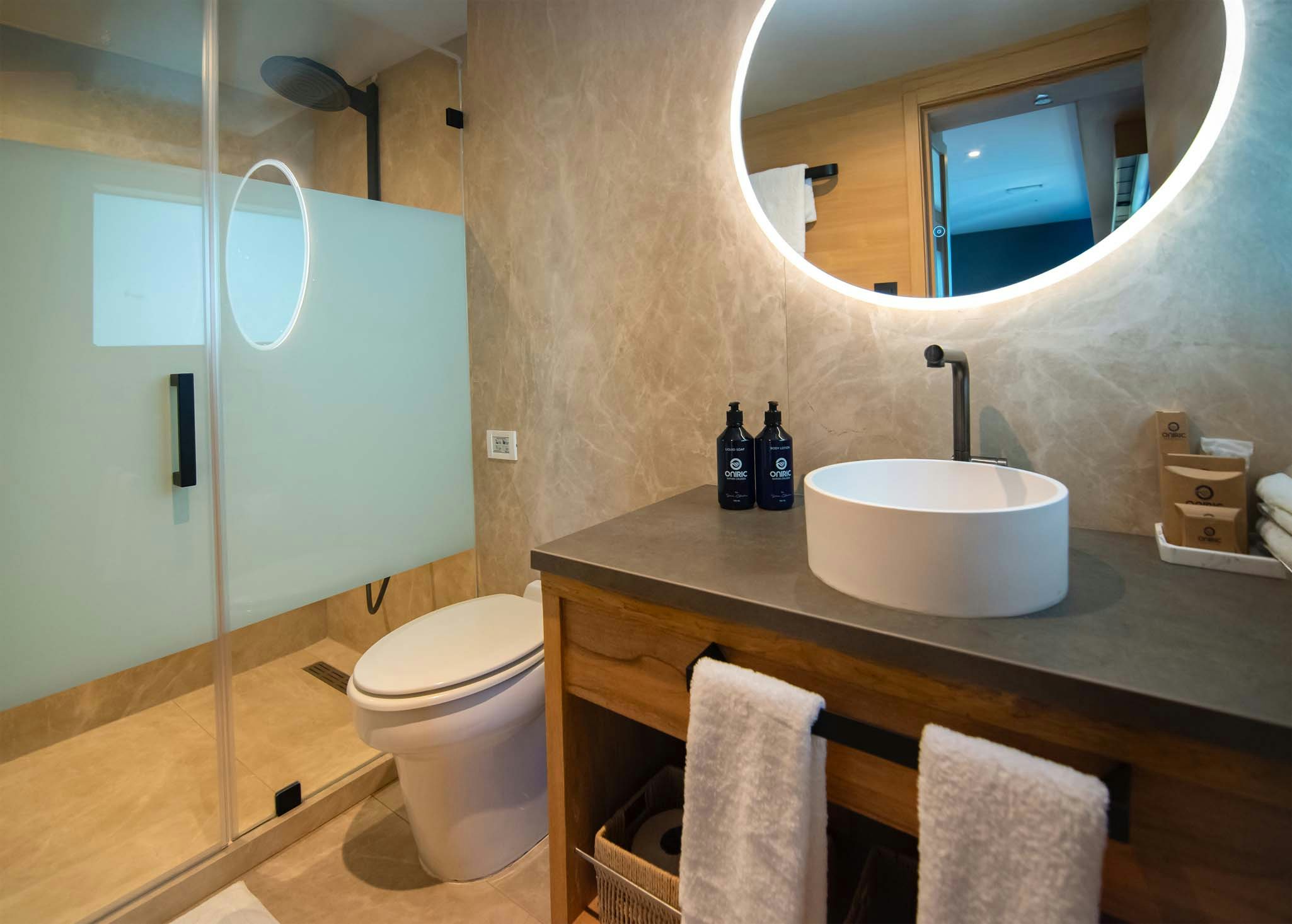 a bathroom with a sink toilet and a mirror aboard TRIBUTE - FREDDY'S LEGACY Yacht for Charter