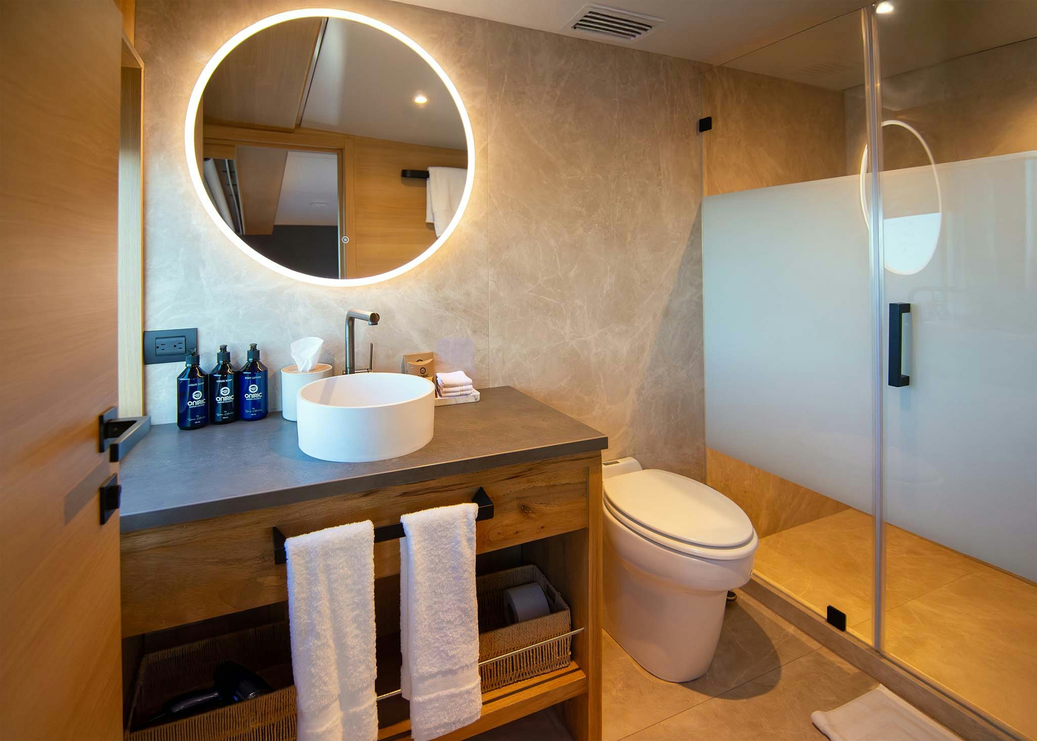 a bathroom with a sink toilet and a mirror aboard TRIBUTE - FREDDY'S LEGACY Yacht for Charter