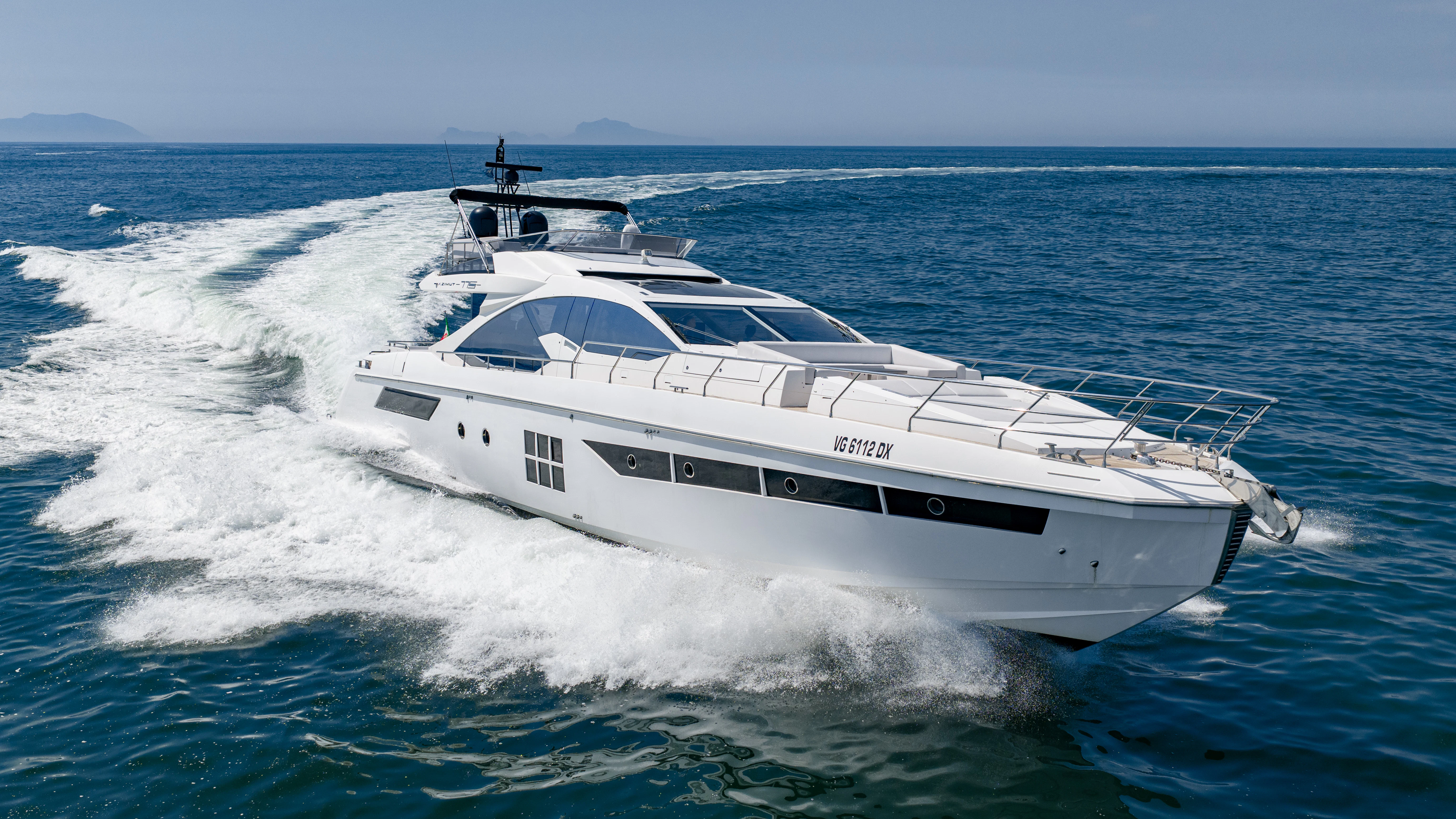 a white yacht on the water aboard JR 28 Yacht for Sale