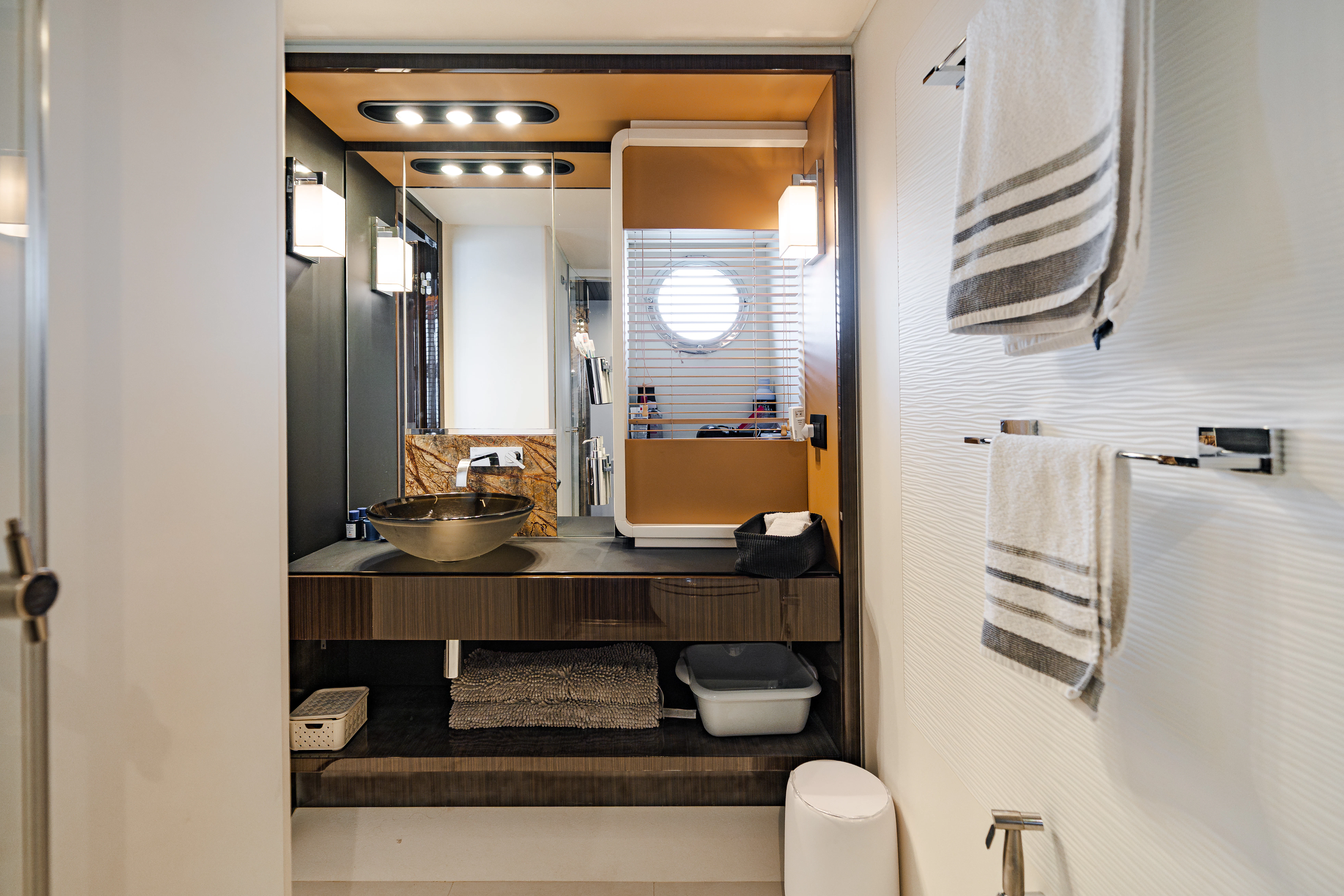 a bathroom with a sink and towels aboard JR 28 Yacht for Sale