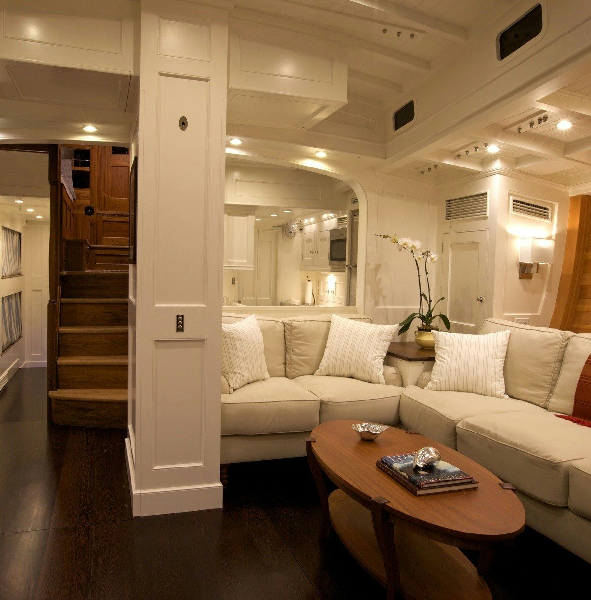 a living room with a white couch aboard BEQUIA Yacht for Sale