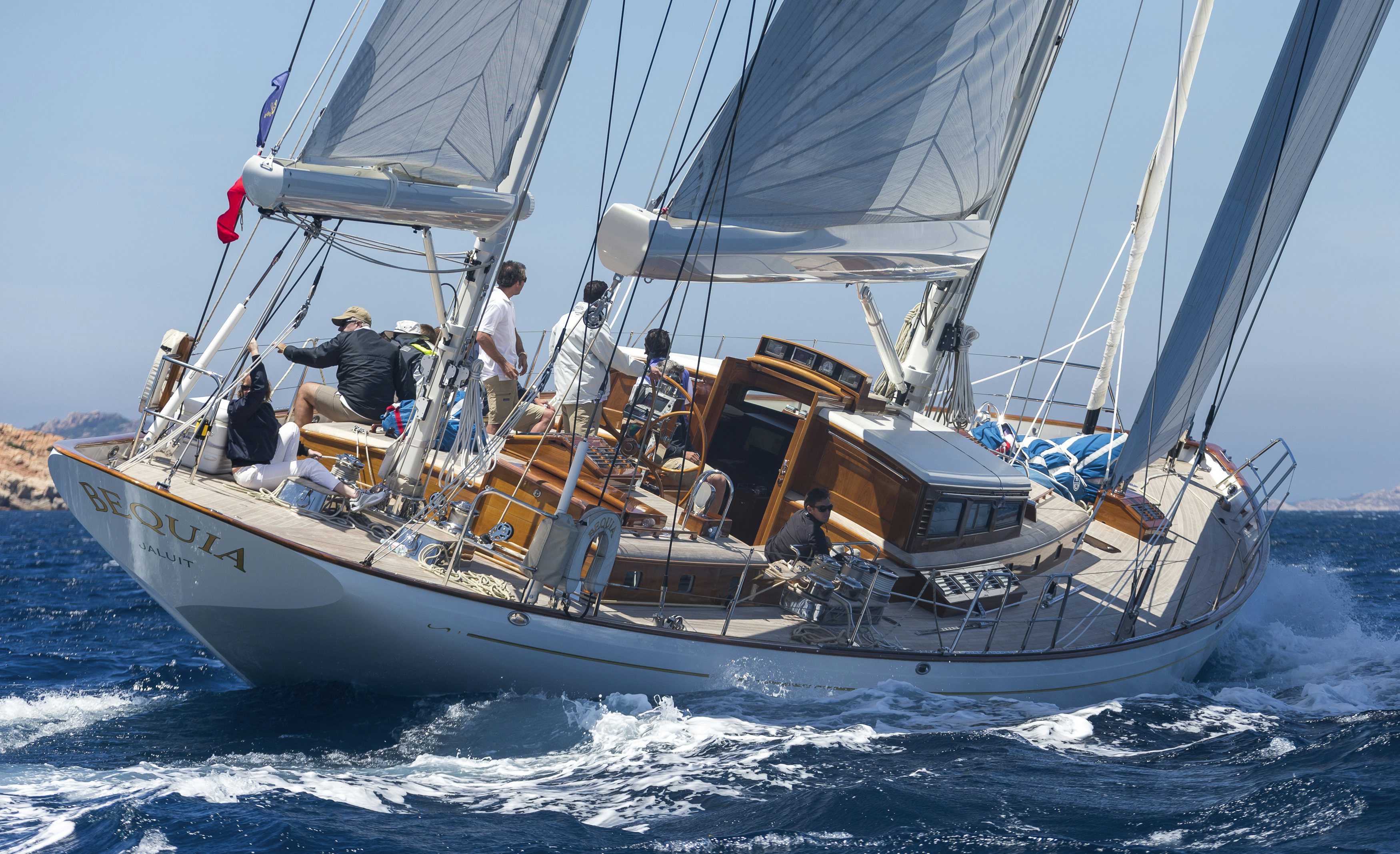 a boat with people on it aboard BEQUIA Yacht for Sale