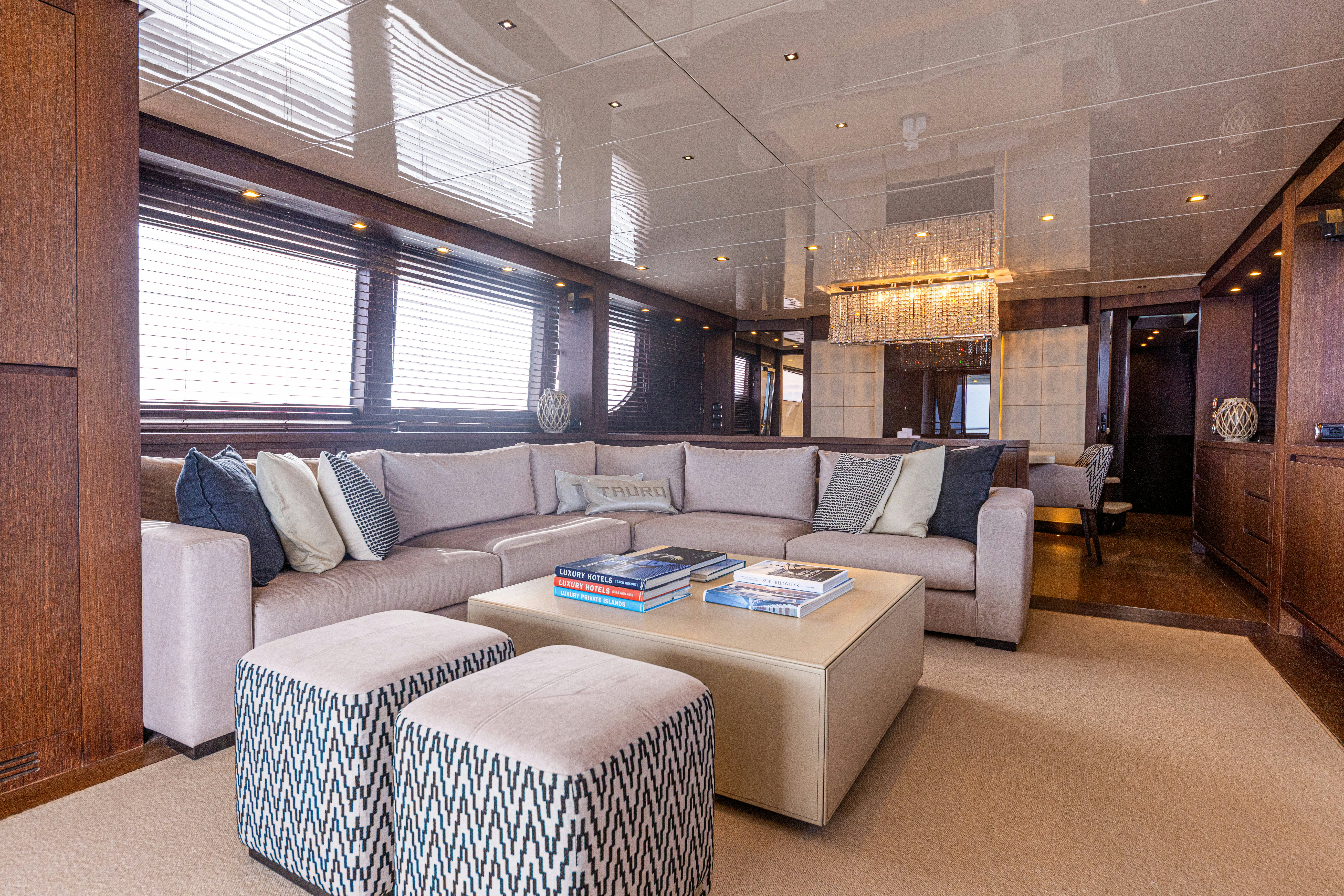 a living room with a couch and a table aboard TAURO Yacht for Sale