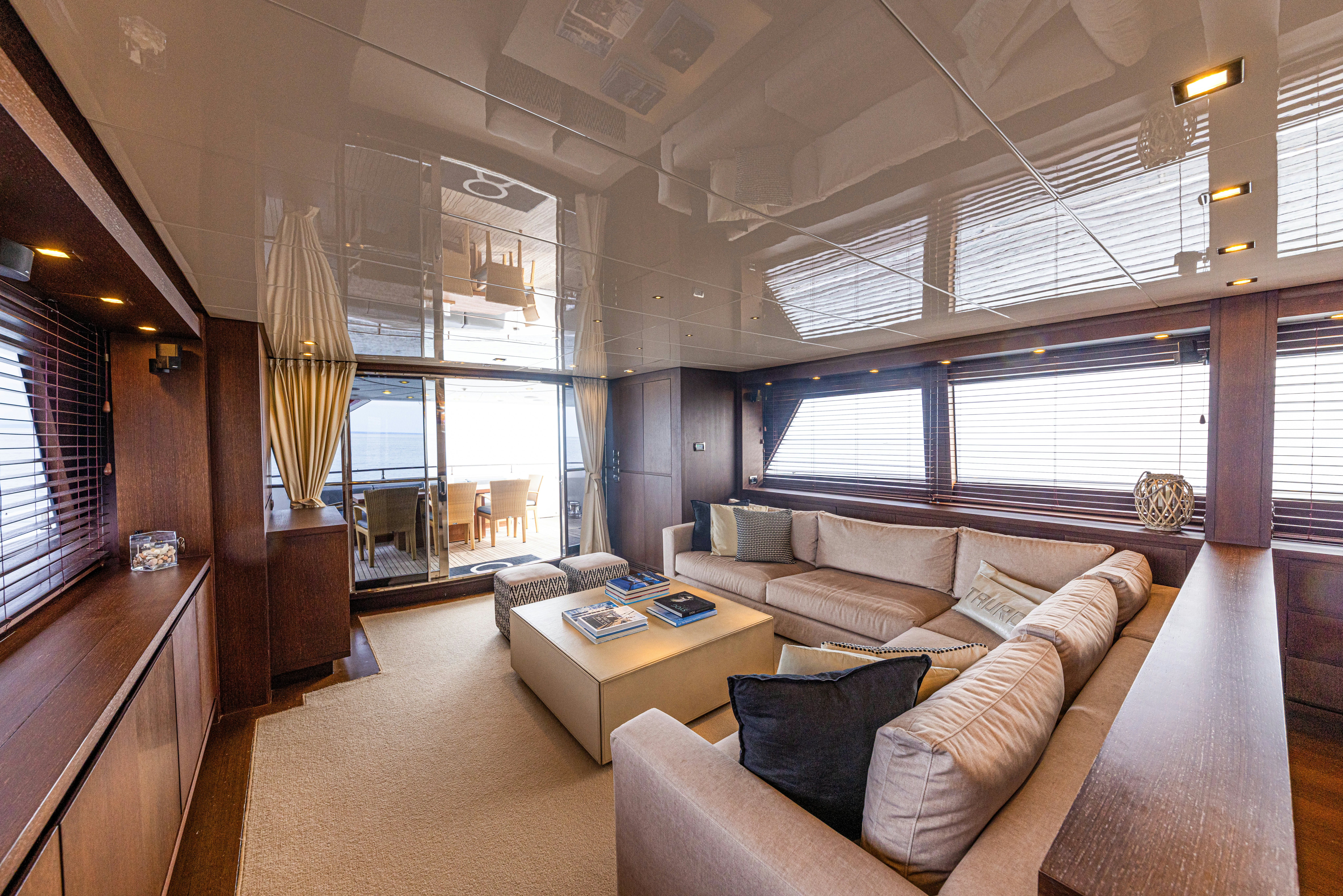a living room with a couch and a table aboard TAURO Yacht for Sale