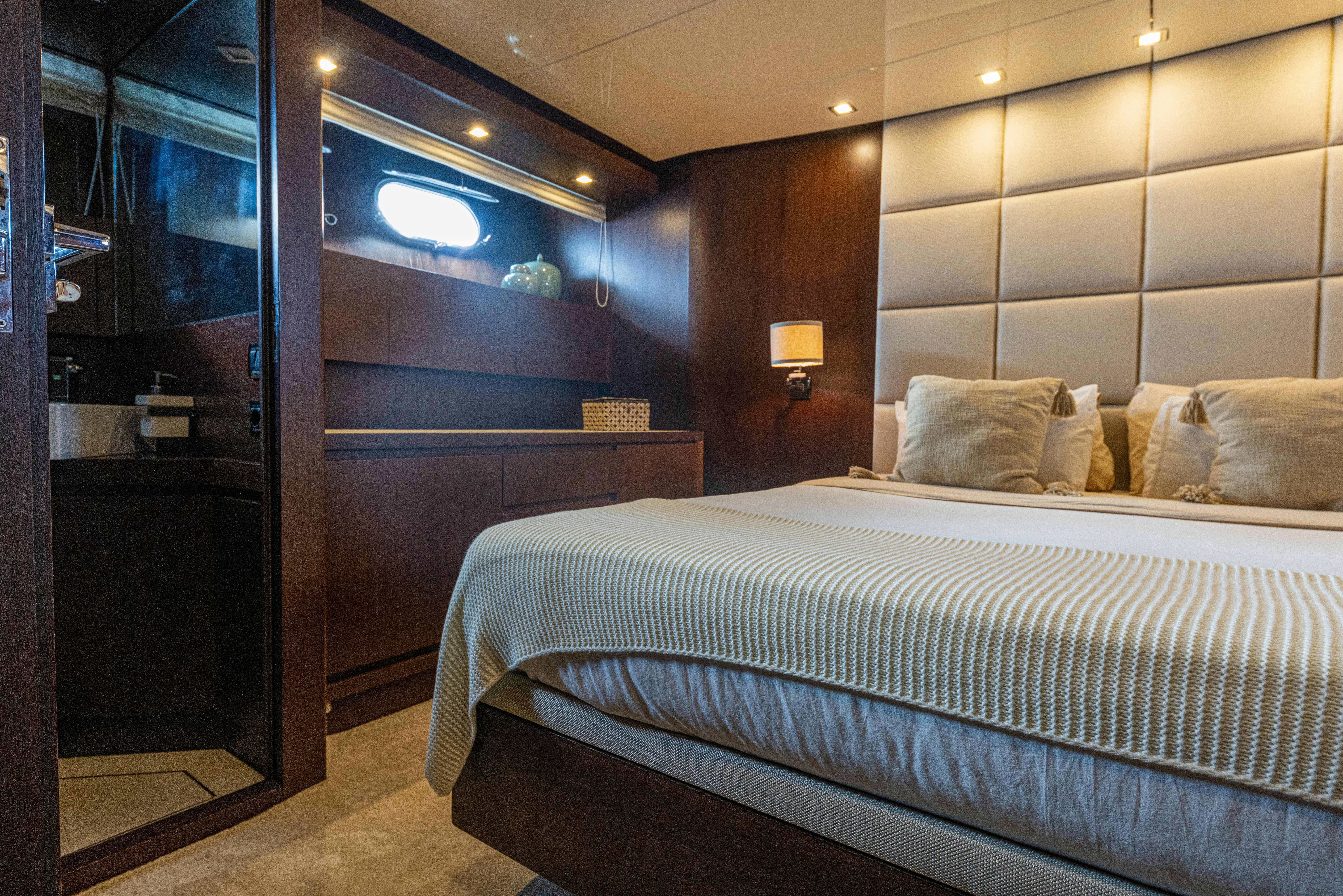 a bed in a room aboard TAURO Yacht for Sale