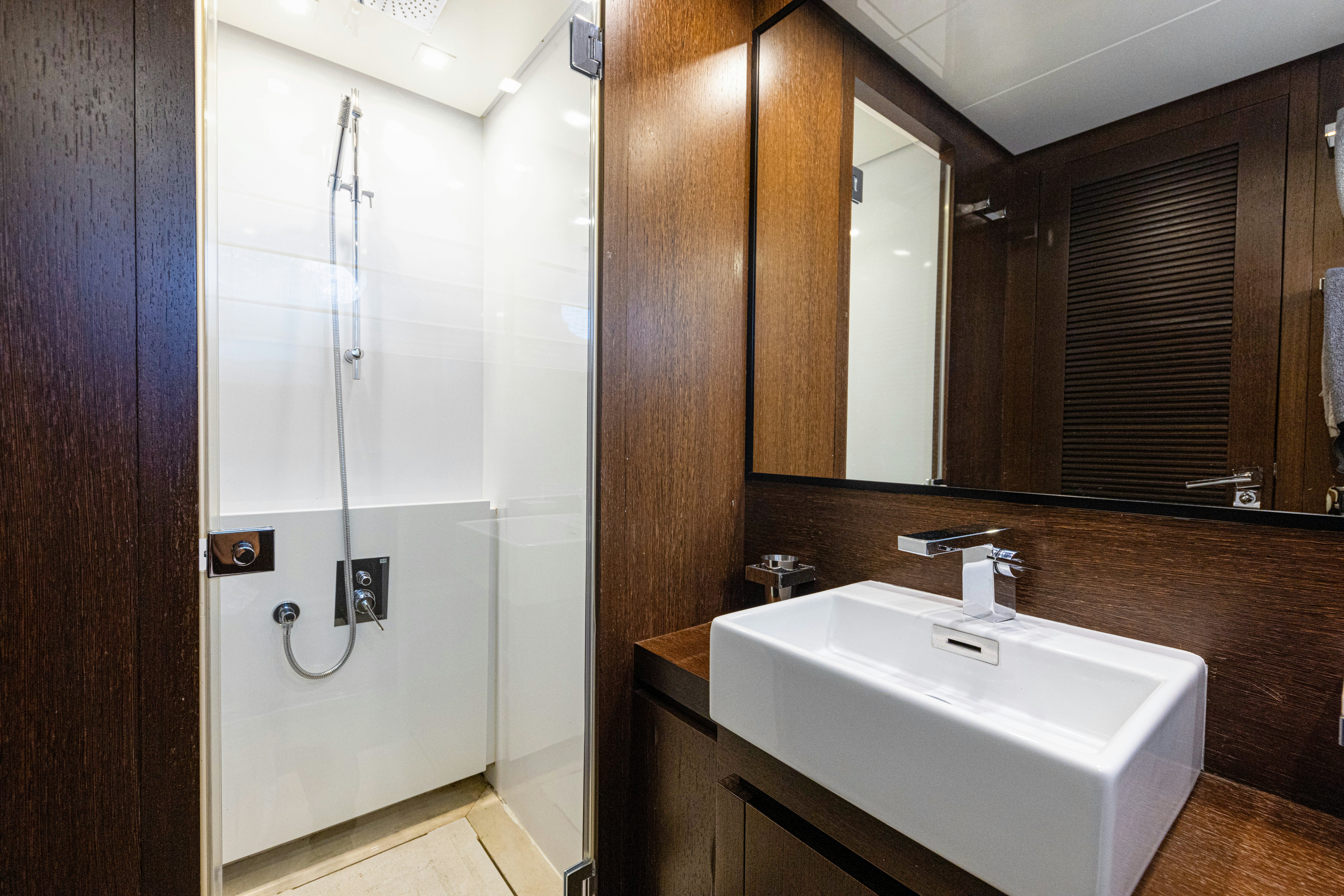 a bathroom with a sink and a mirror aboard TAURO Yacht for Sale