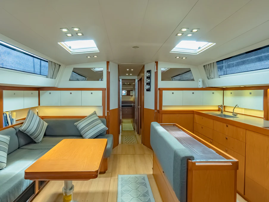 a room with a couch and a table aboard IMPERIA Yacht for Sale