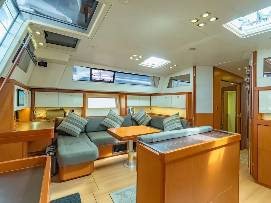 a room with a couch and a desk aboard IMPERIA Yacht for Sale