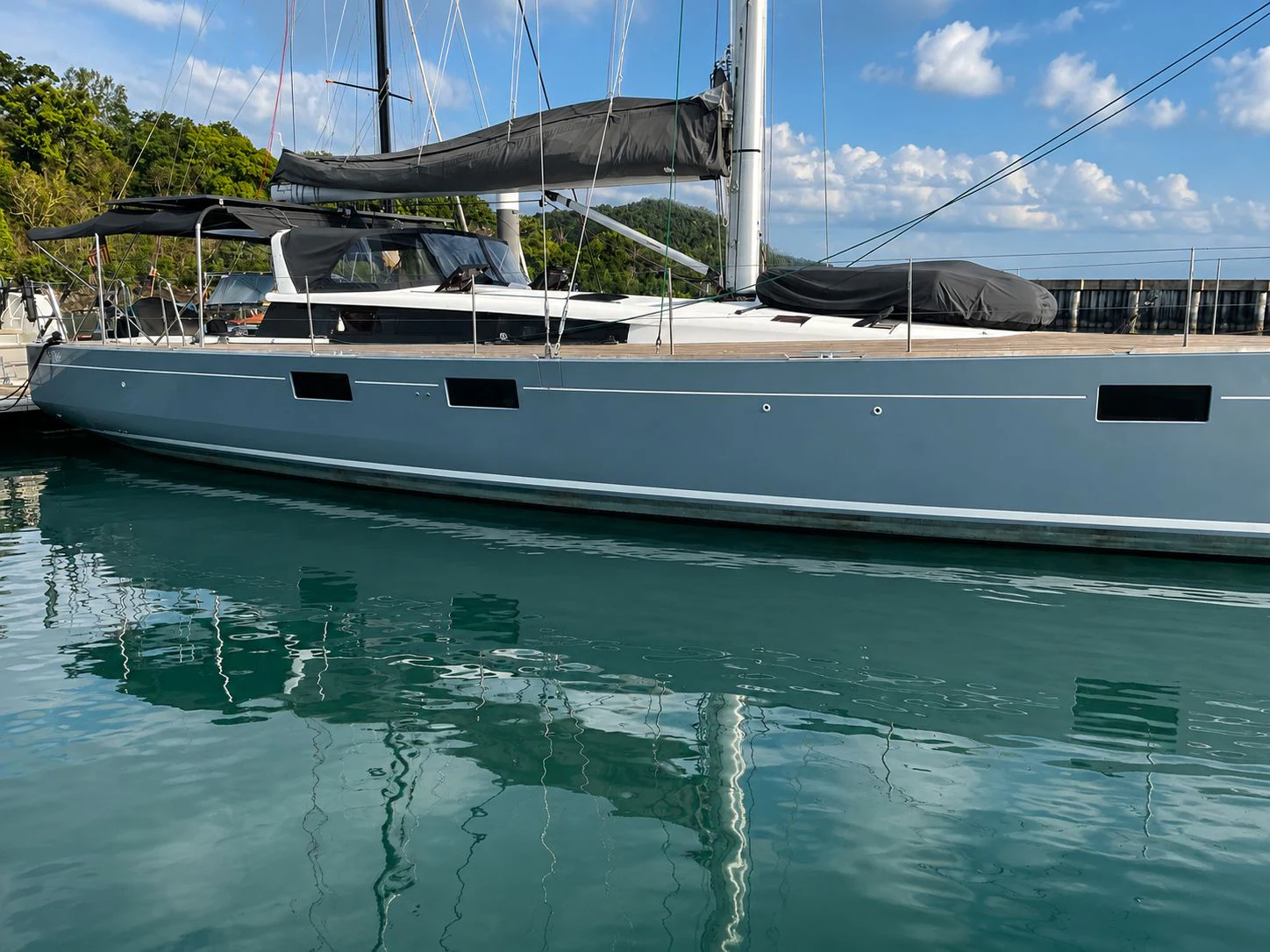 a white boat in a body of water aboard IMPERIA Yacht for Sale