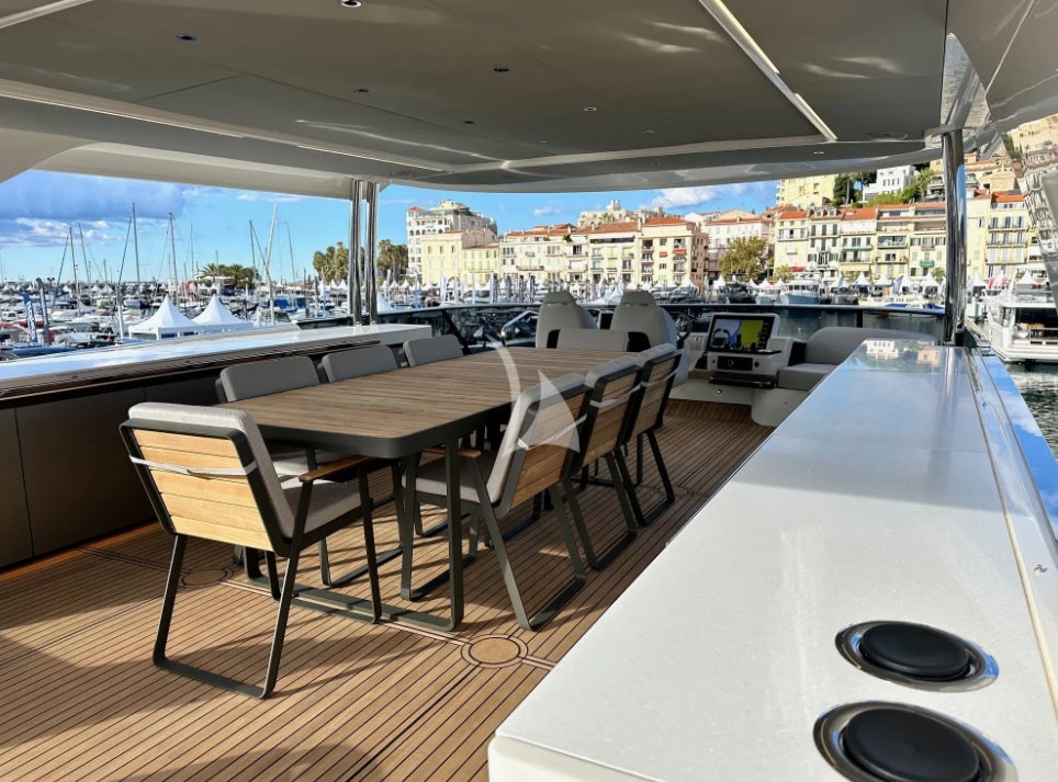 a table and chairs in a room aboard SEMELA Yacht for Charter