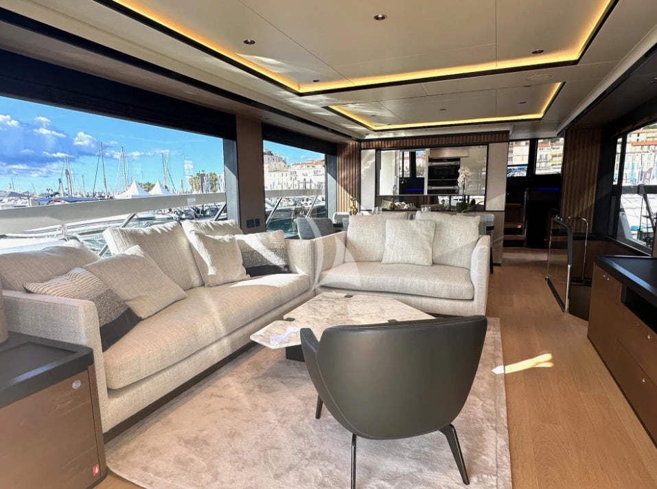 a living room with a large window aboard SEMELA Yacht for Charter