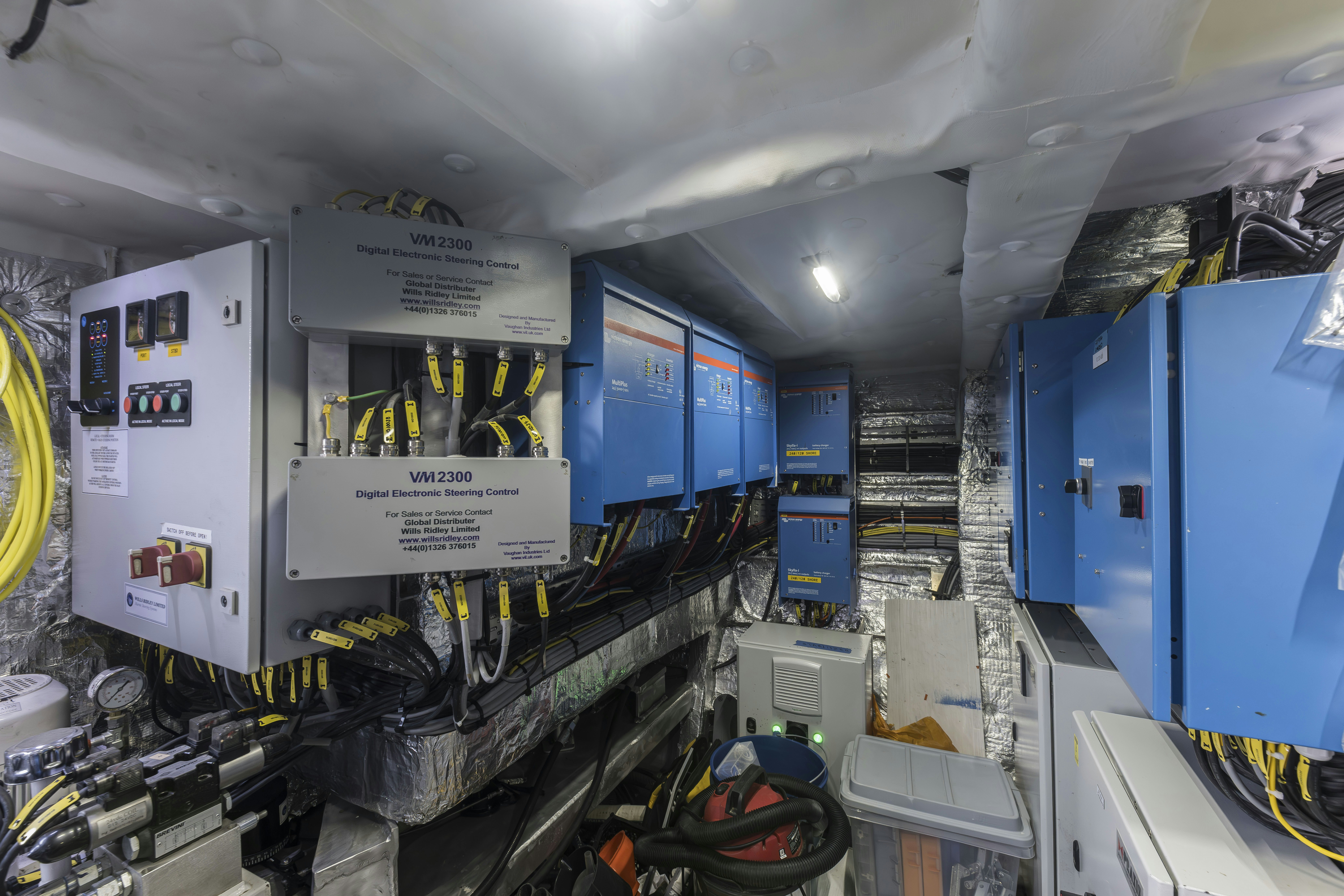 a large room with several machines aboard VANGUARD Yacht for Sale