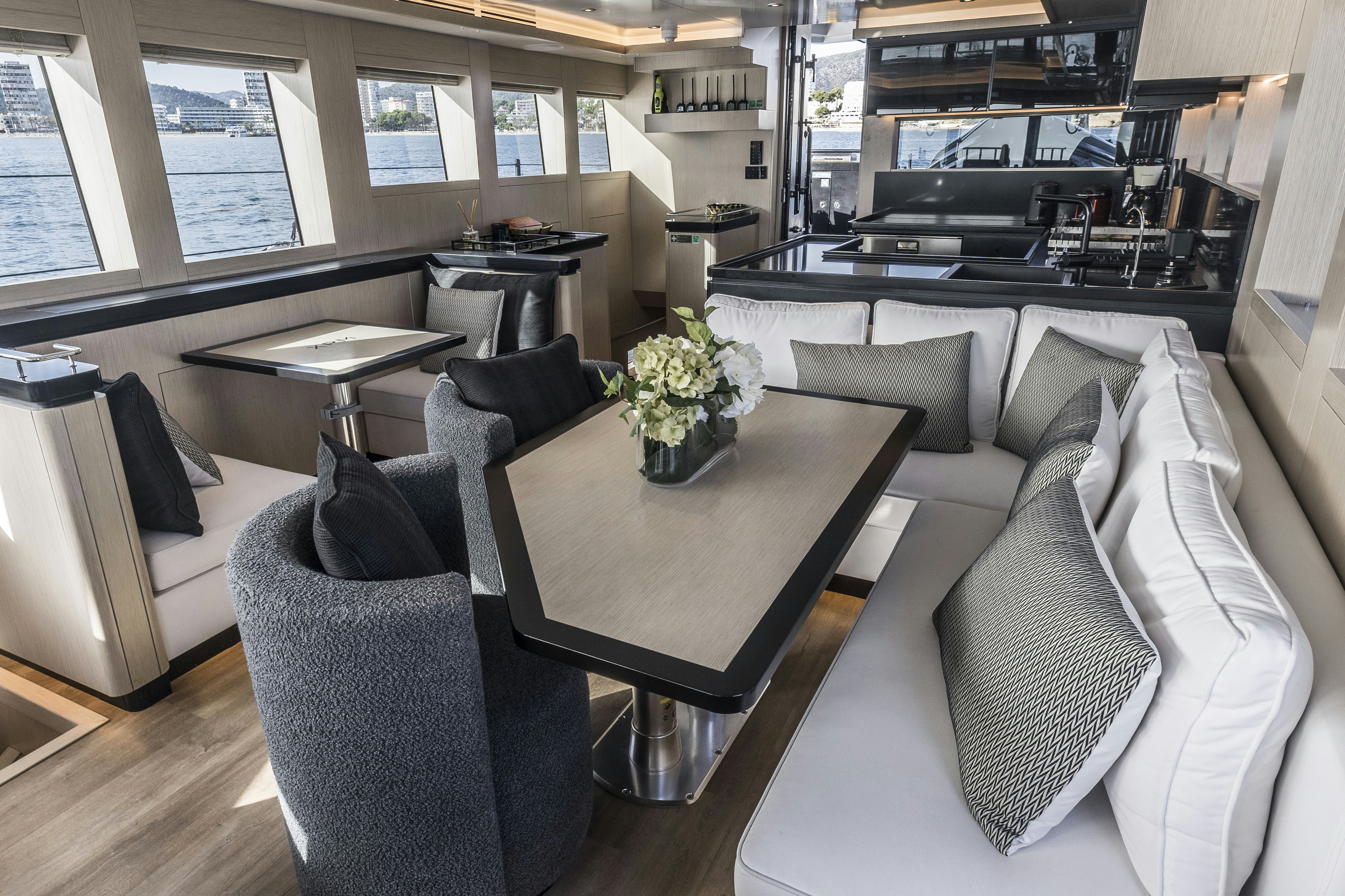 a living room with a couch and a coffee table aboard VANGUARD Yacht for Sale