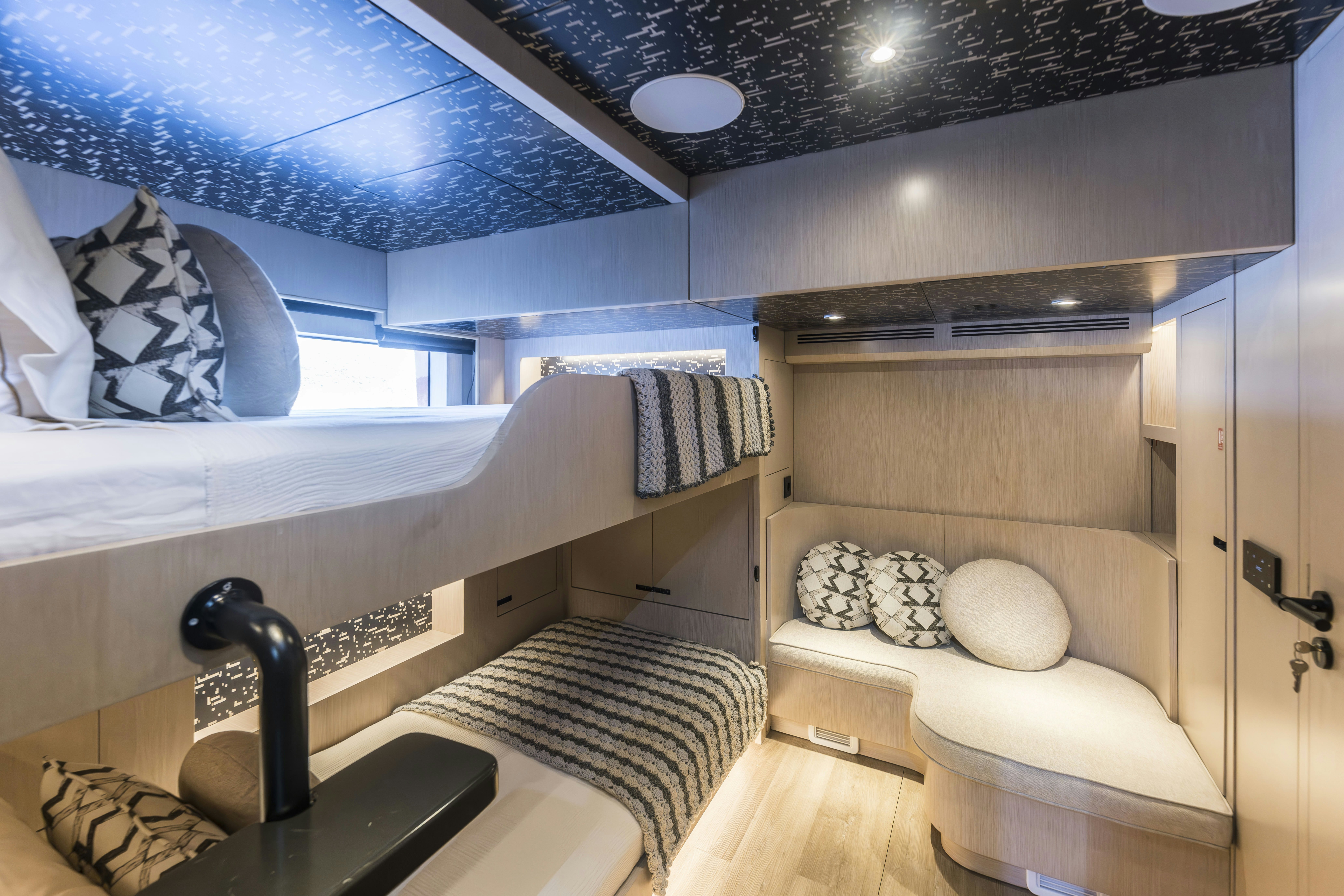 a room with a bed and a couch aboard VANGUARD Yacht for Sale