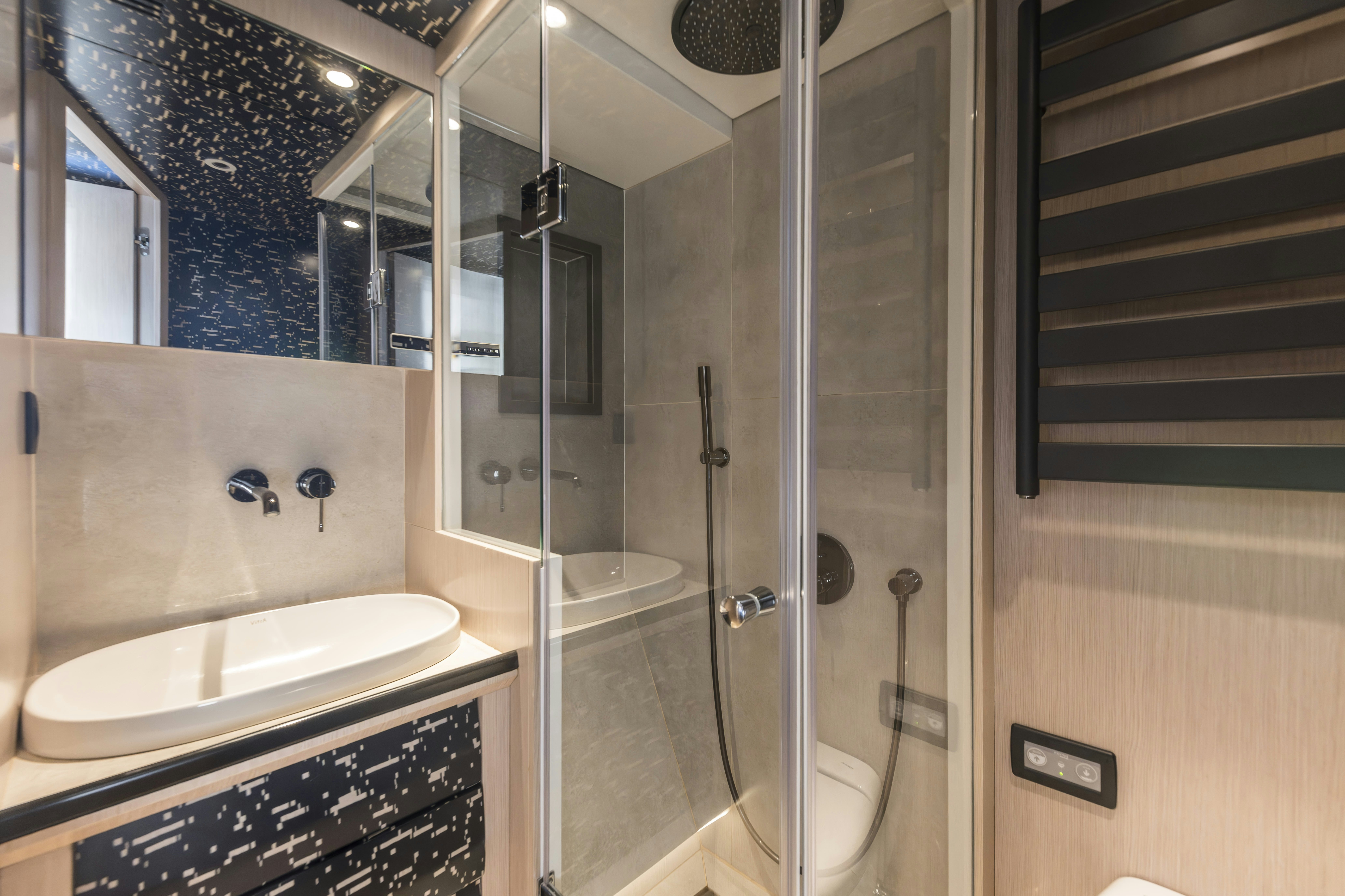 a bathroom with a glass shower aboard VANGUARD Yacht for Sale