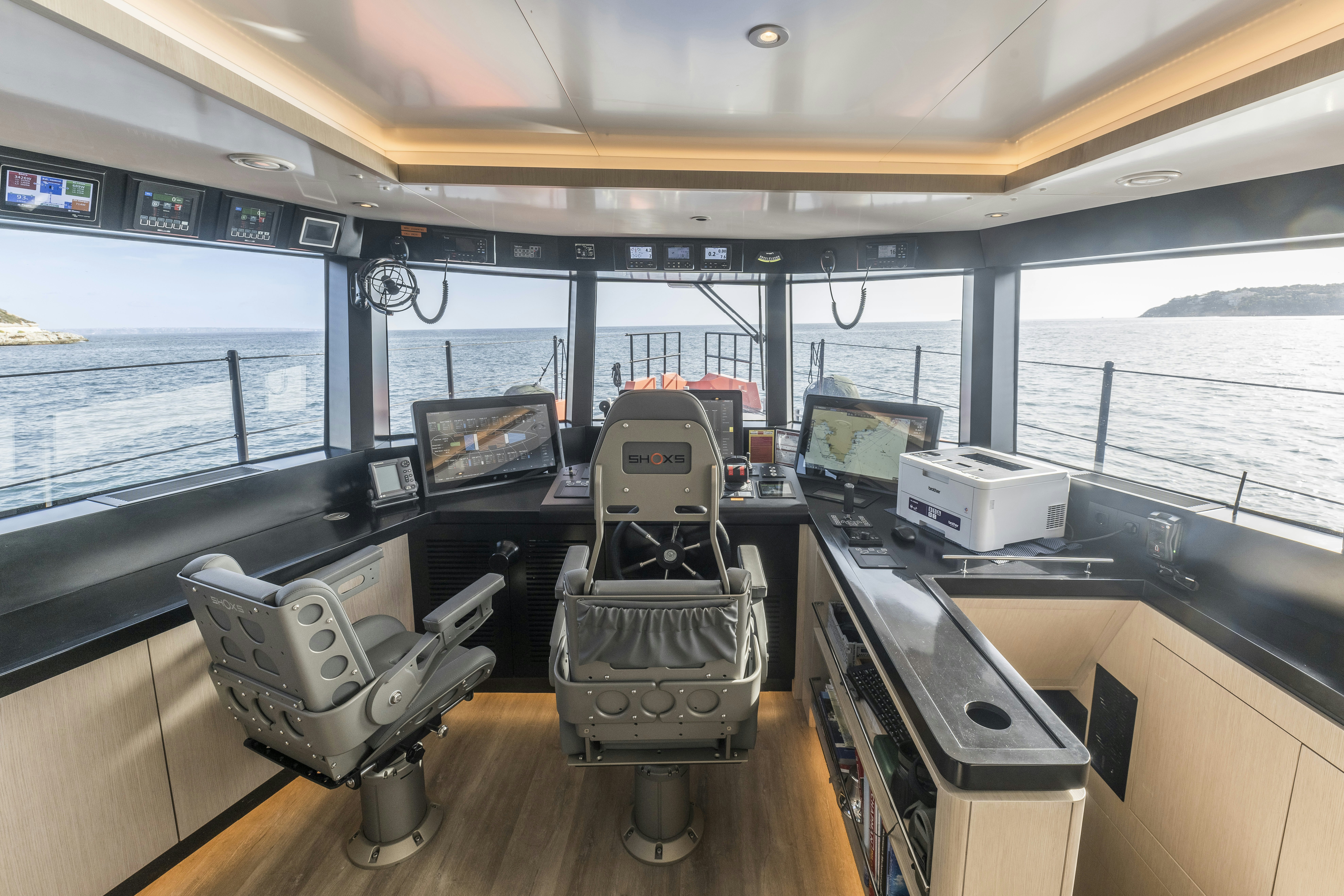 inside of a building with computers aboard VANGUARD Yacht for Sale