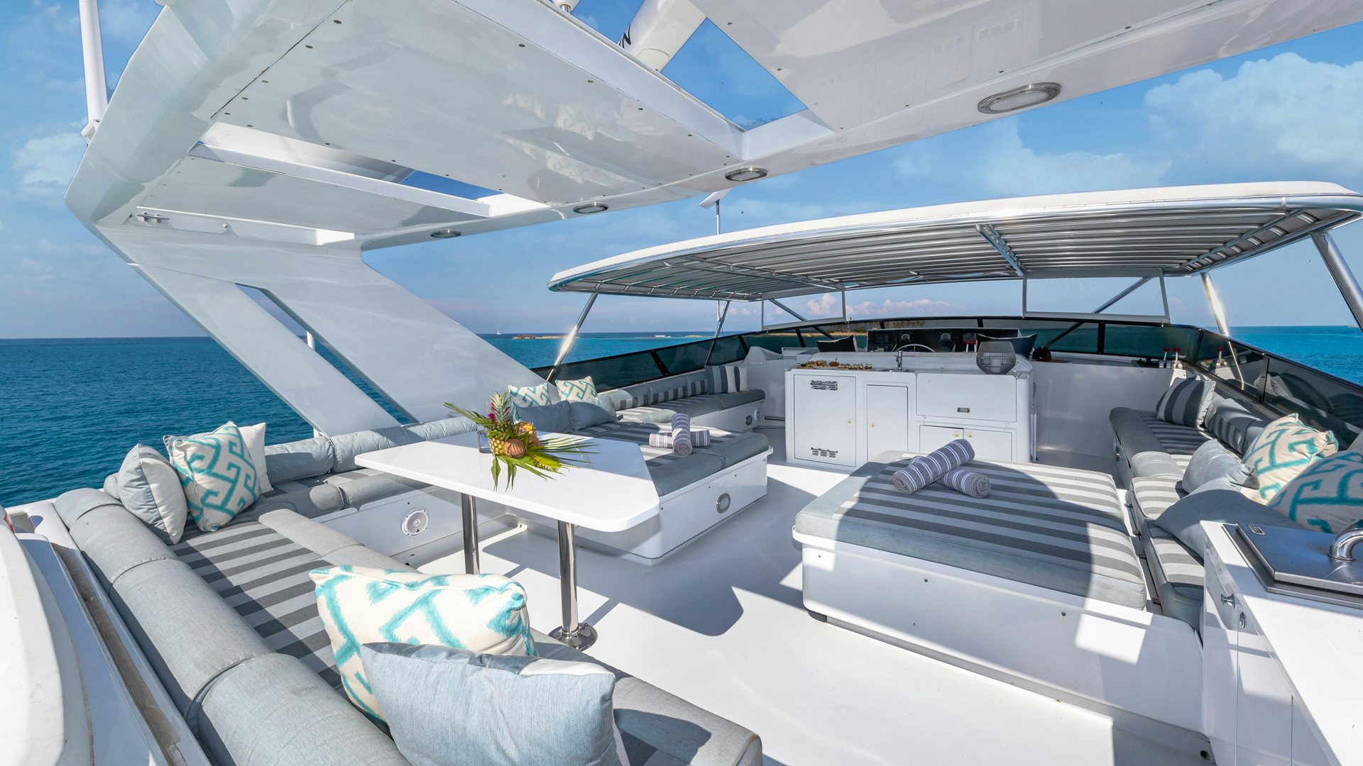a boat with a table and chairs aboard MARGATE Yacht for Sale