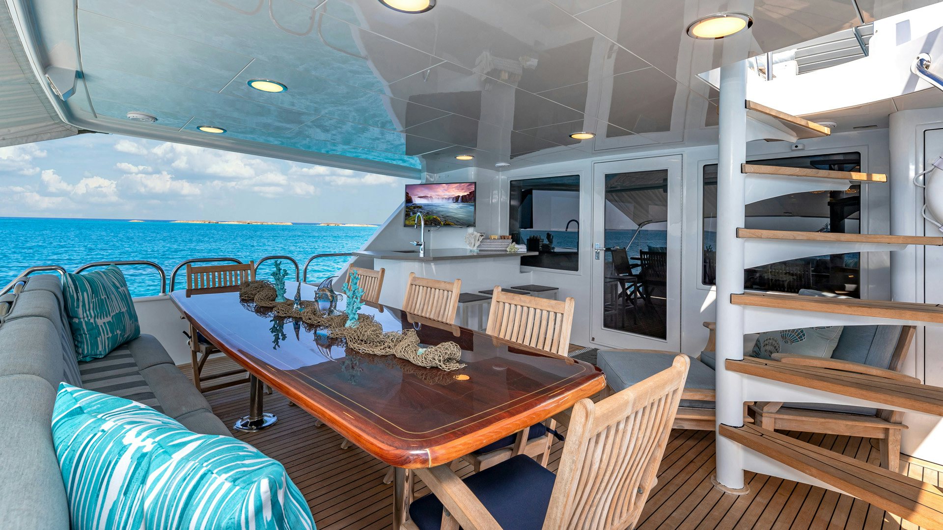 a room with a table and chairs aboard MARGATE Yacht for Sale