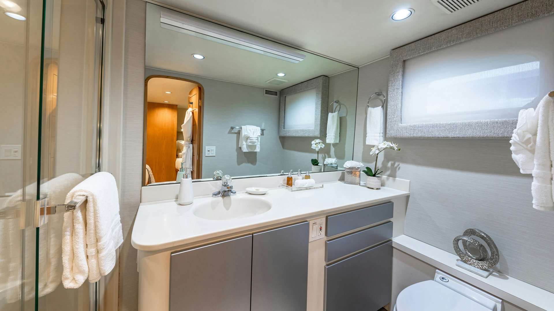 a bathroom with a large mirror aboard MARGATE Yacht for Sale