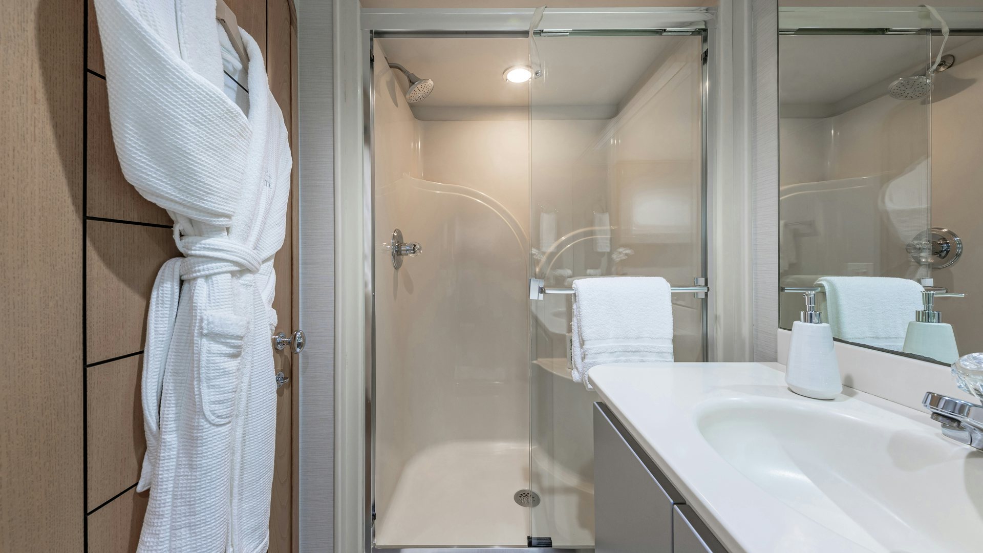 a bathroom with a bathtub sink and a shower aboard MARGATE Yacht for Sale