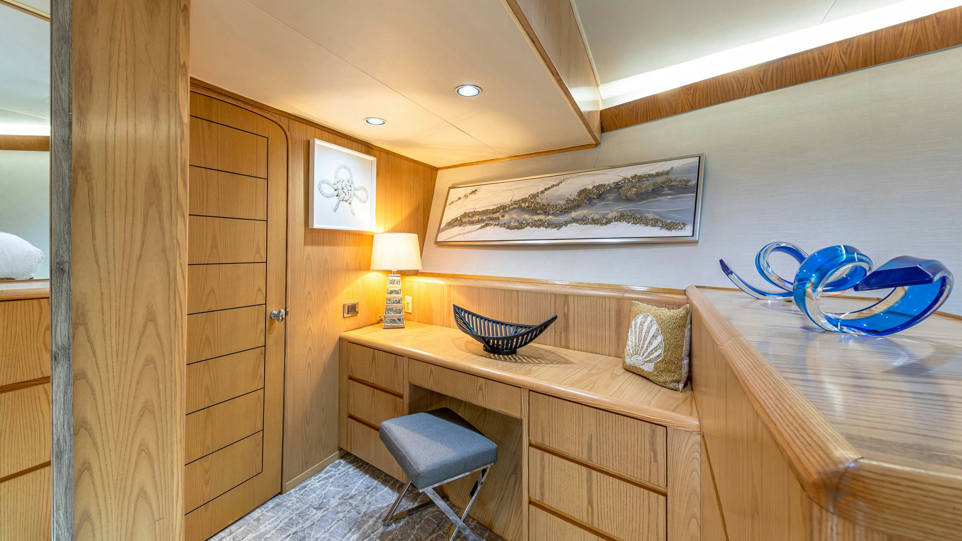 a room with a desk and a bed aboard MARGATE Yacht for Sale