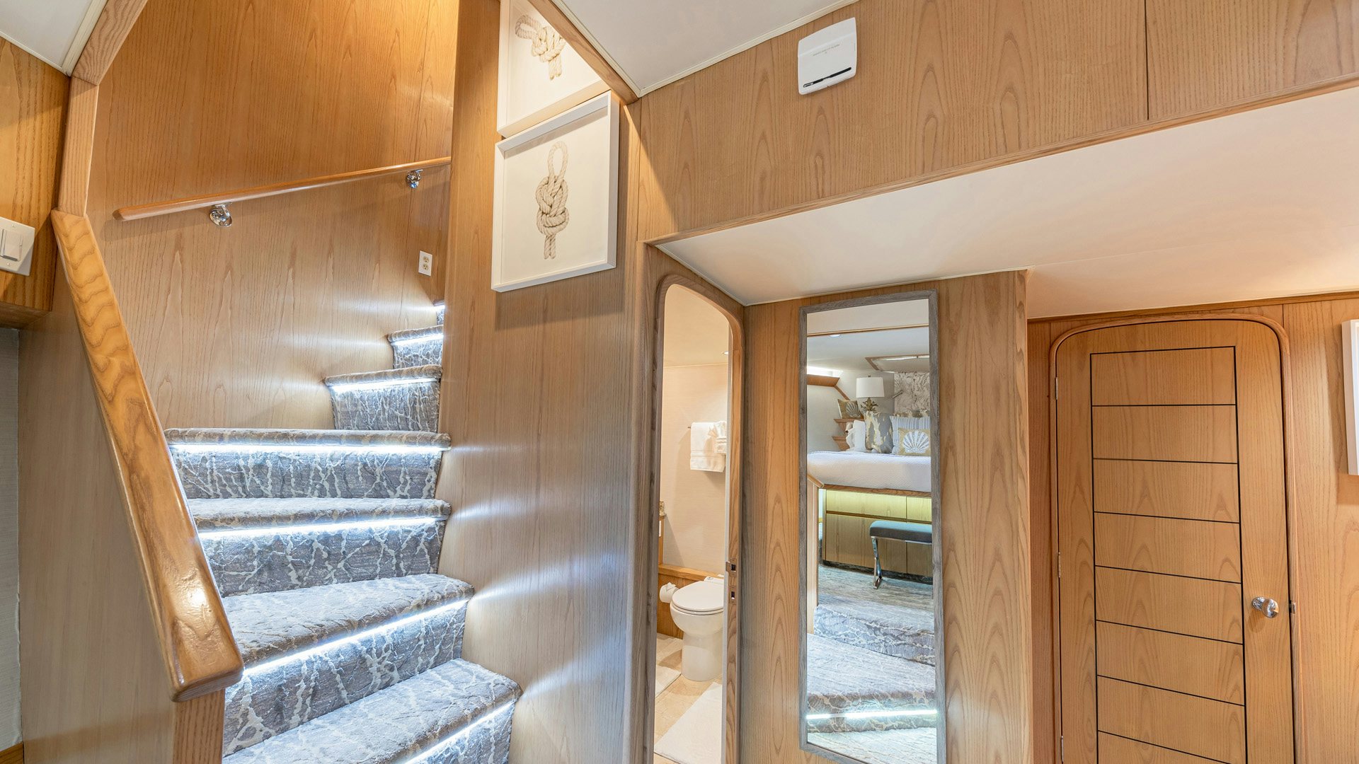 a room with a bed and a door aboard MARGATE Yacht for Sale