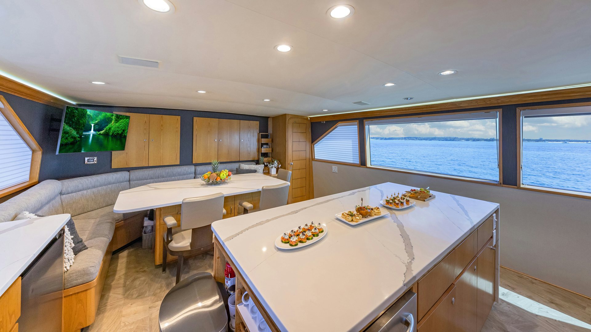 a large kitchen with a table and chairs aboard MARGATE Yacht for Sale