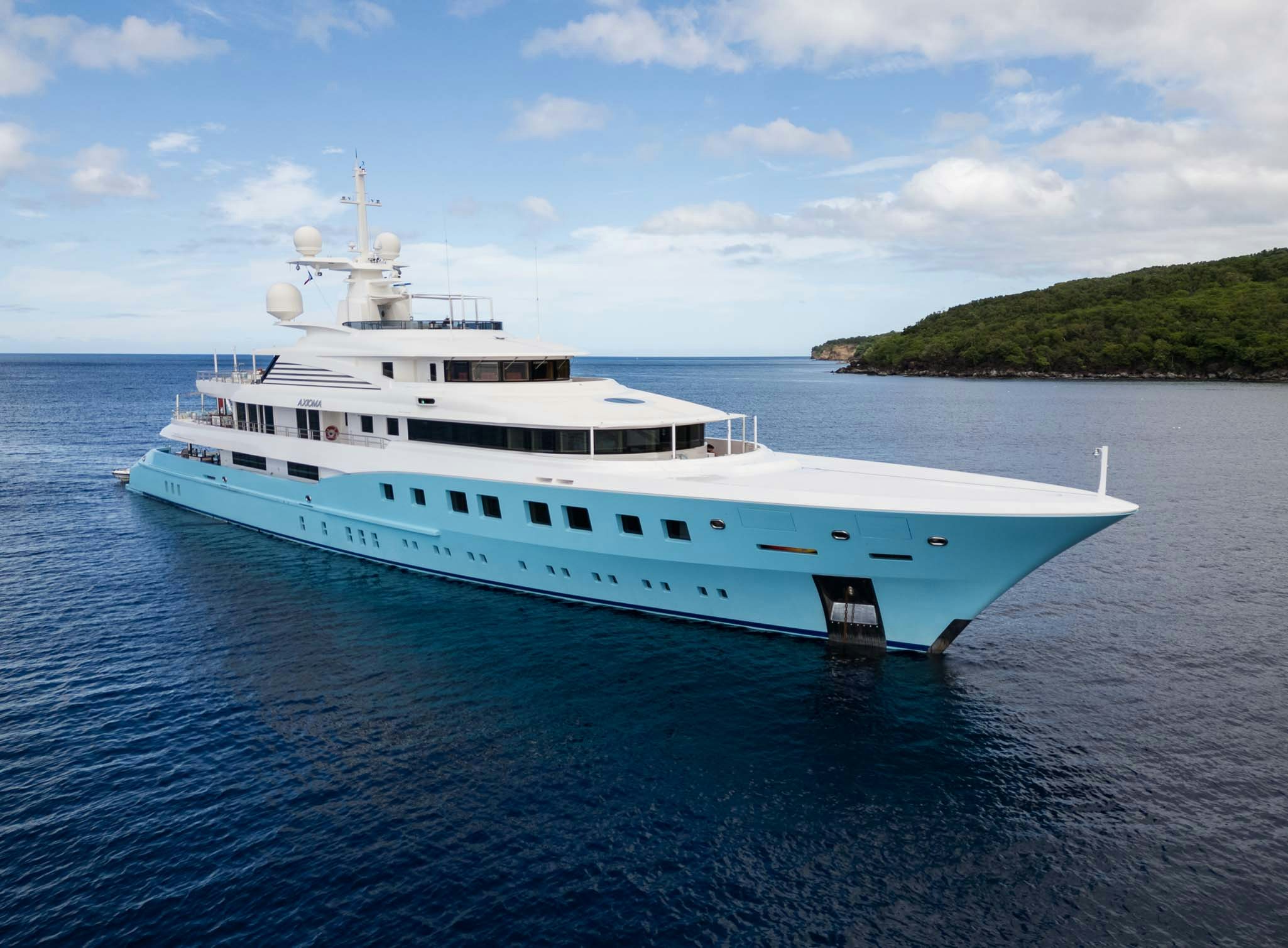 a white boat in the water aboard AXIOMA Yacht for Charter