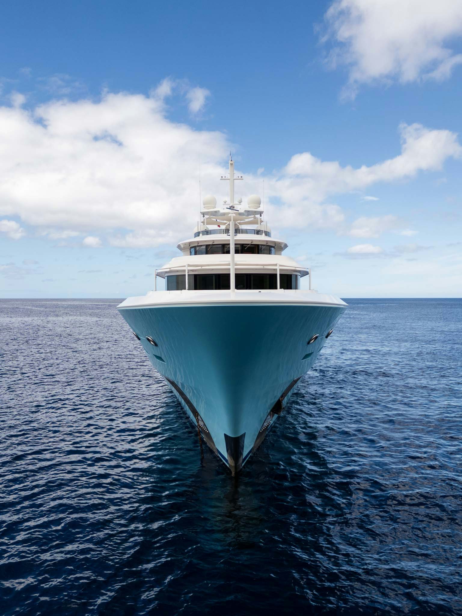 a white boat in the water aboard AXIOMA Yacht for Charter