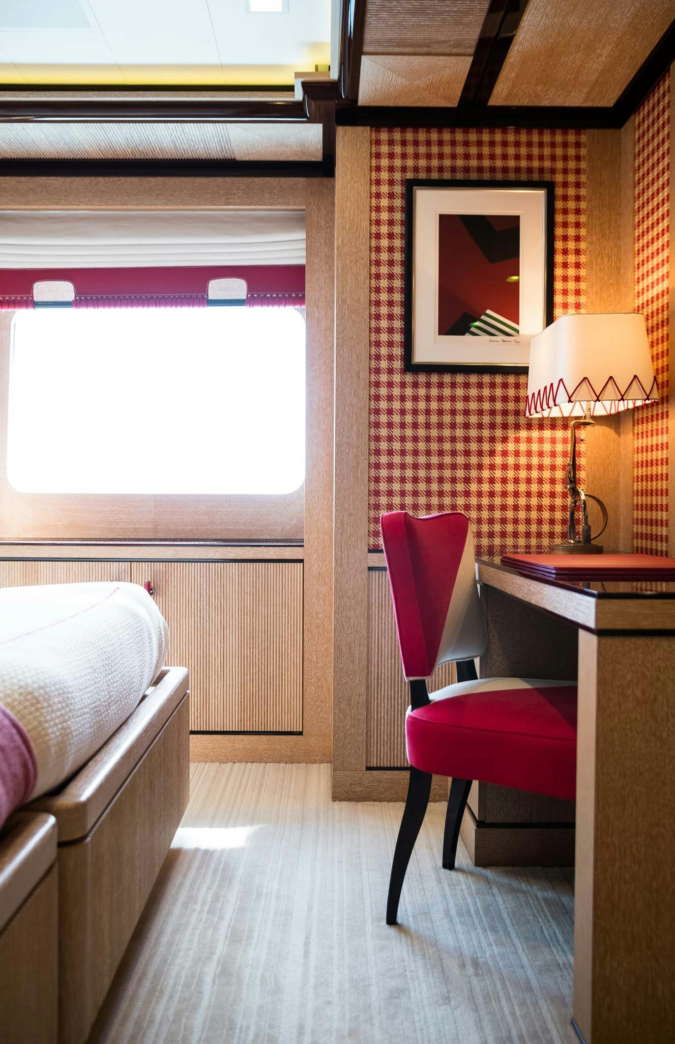 a room with a desk and a chair aboard AXIOMA Yacht for Charter