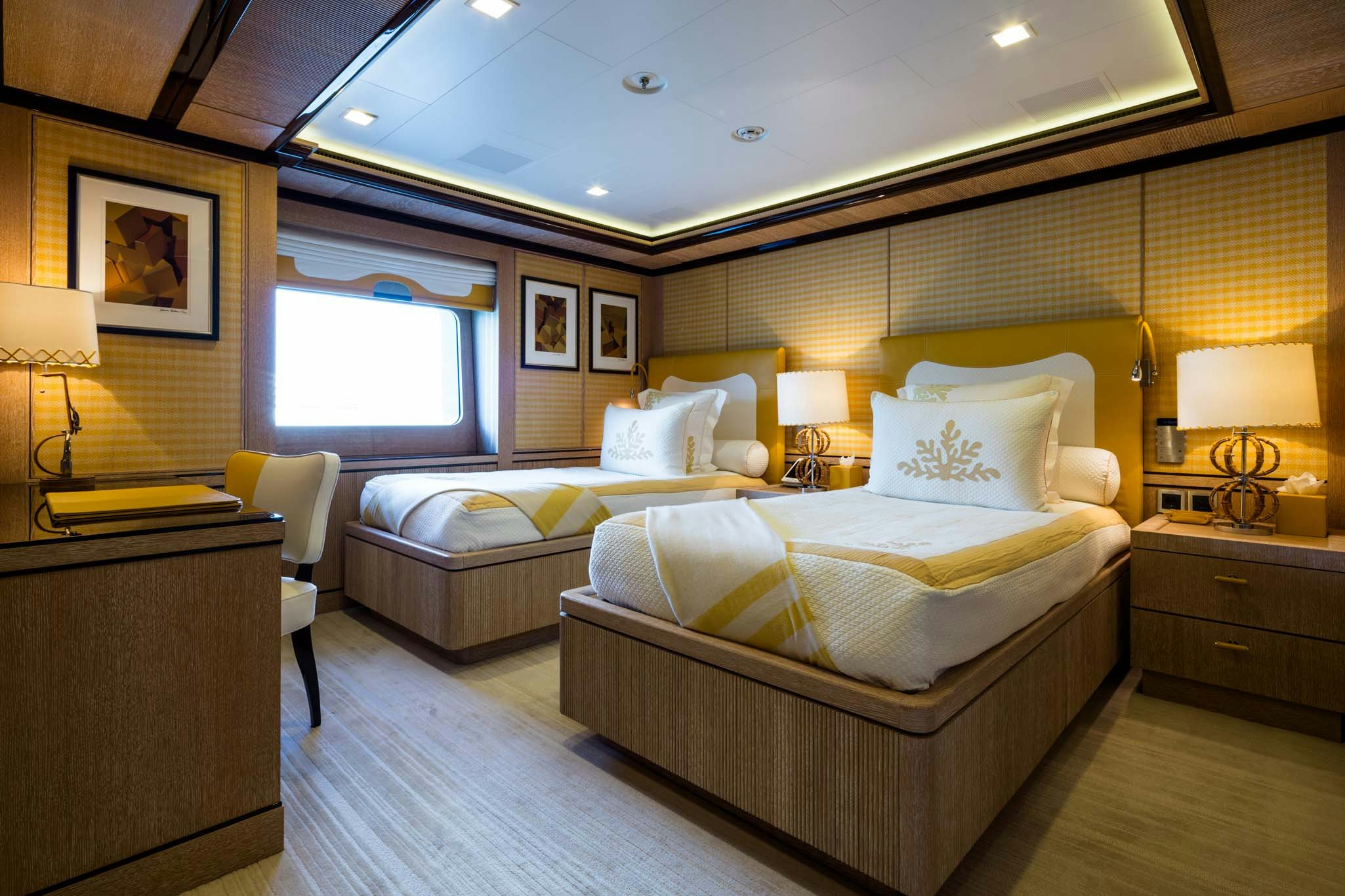 a room with a couple of beds aboard AXIOMA Yacht for Charter