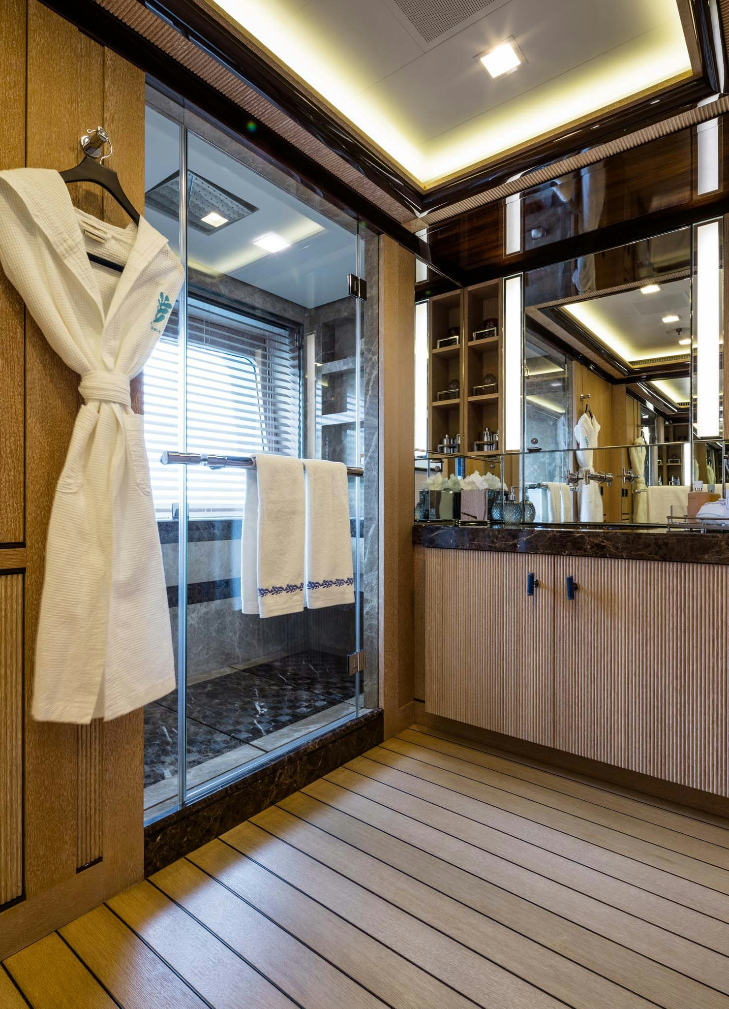 a bathroom with a large glass shower aboard AXIOMA Yacht for Charter