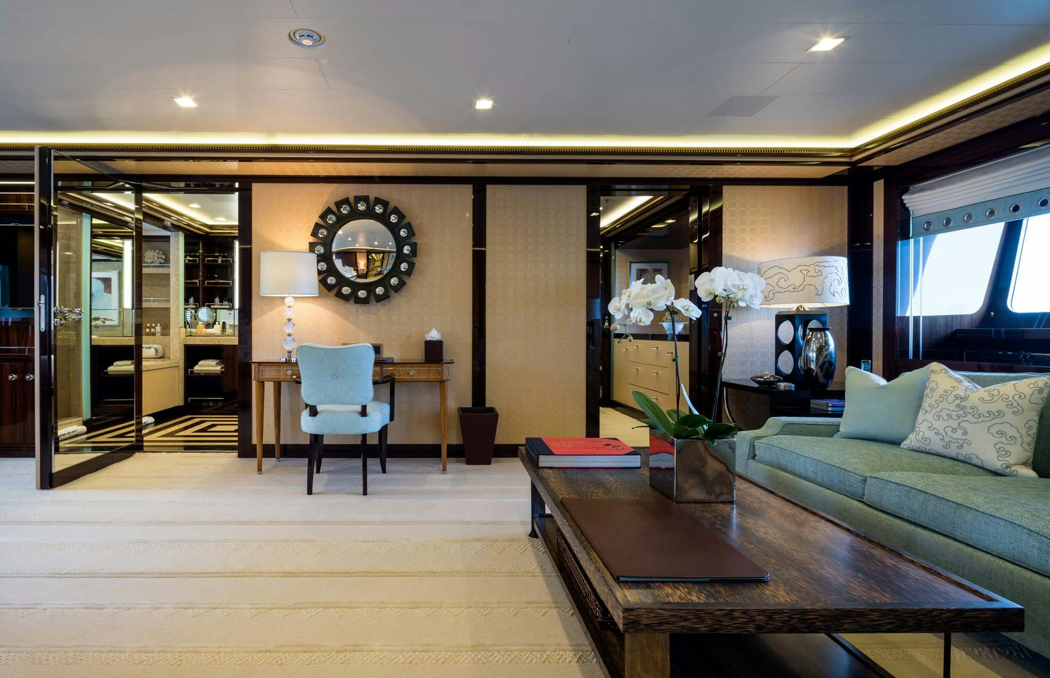 a living room with a couch and coffee table aboard AXIOMA Yacht for Charter