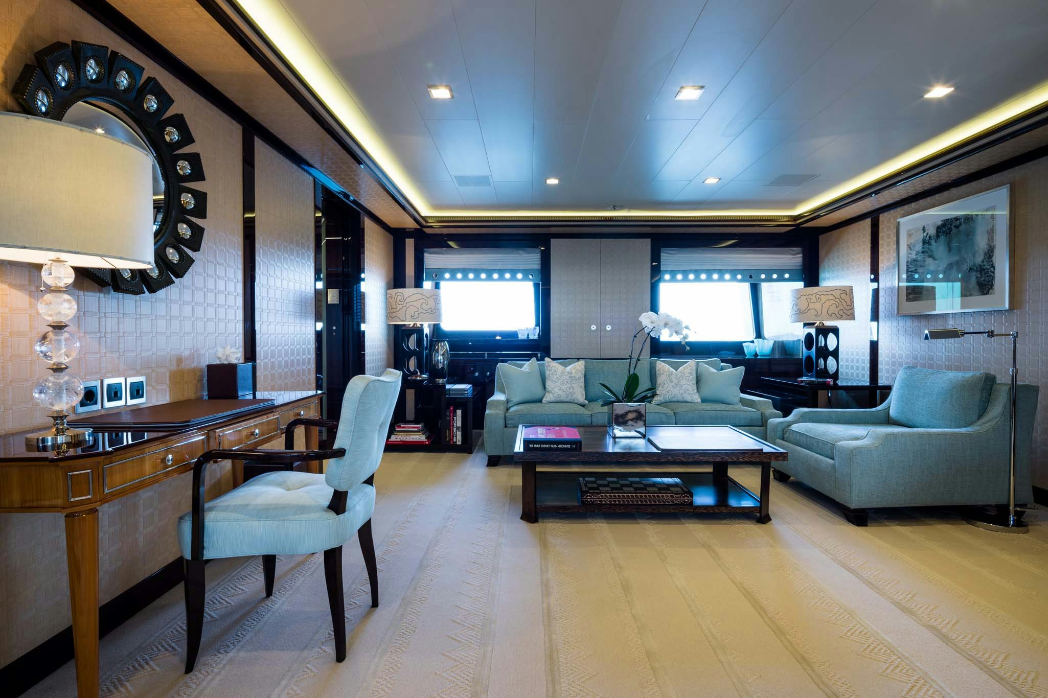 a living room with a large mirror aboard AXIOMA Yacht for Charter