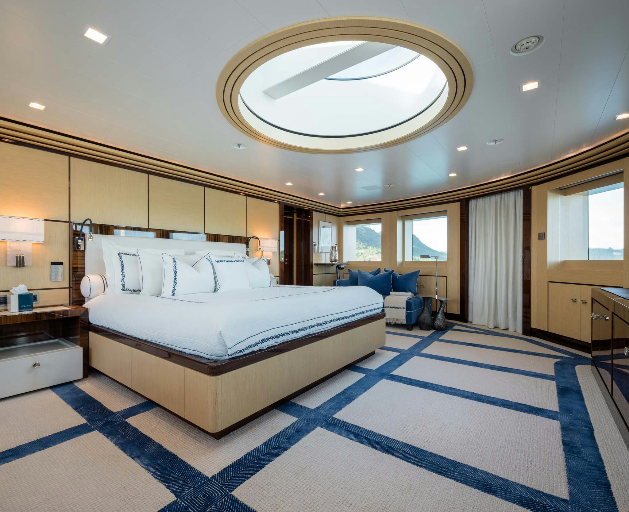 a large bedroom with a large bed aboard AXIOMA Yacht for Charter